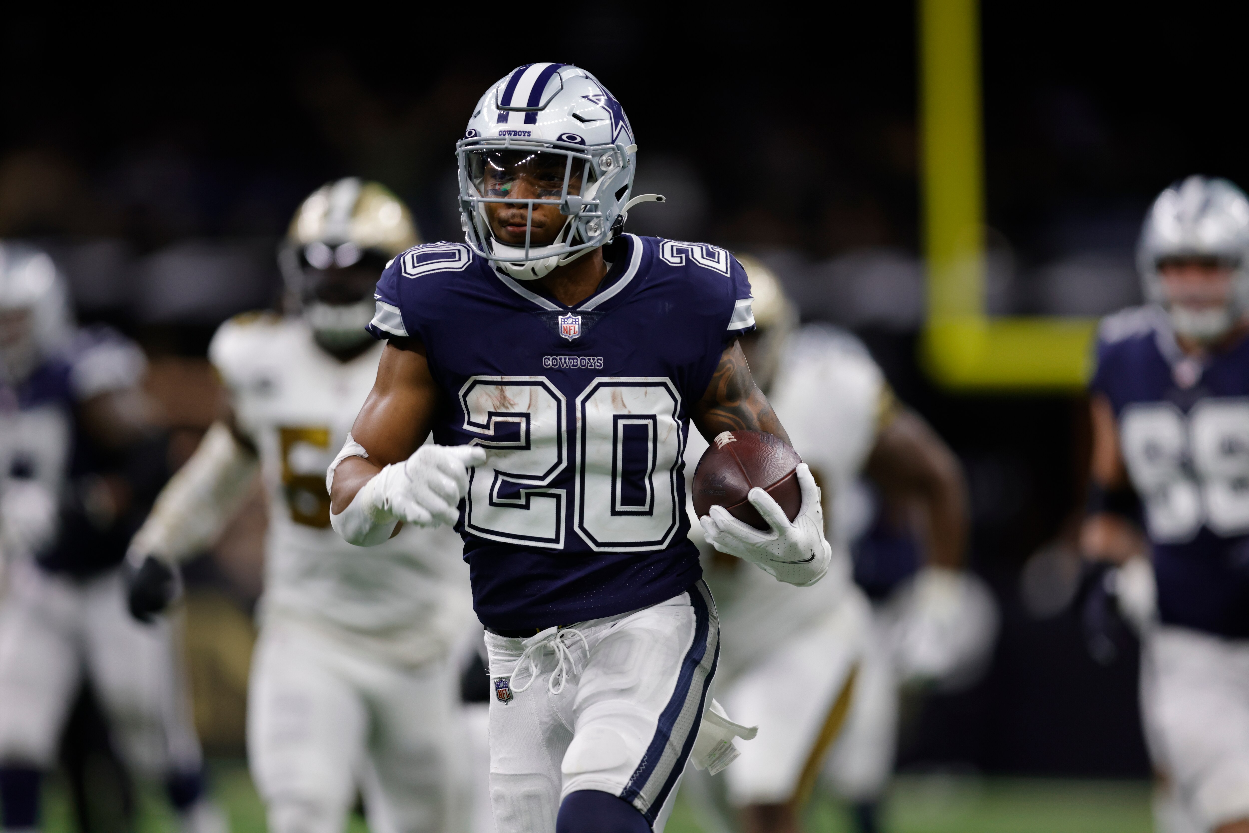 Dallas Cowboys running back Tony Pollard (20) runs against the New Orleans Saints during the second half of an NFL football game, Thursday, Dec. 2, 2021, in New Orleans. (AP Photo/Brett Duke)