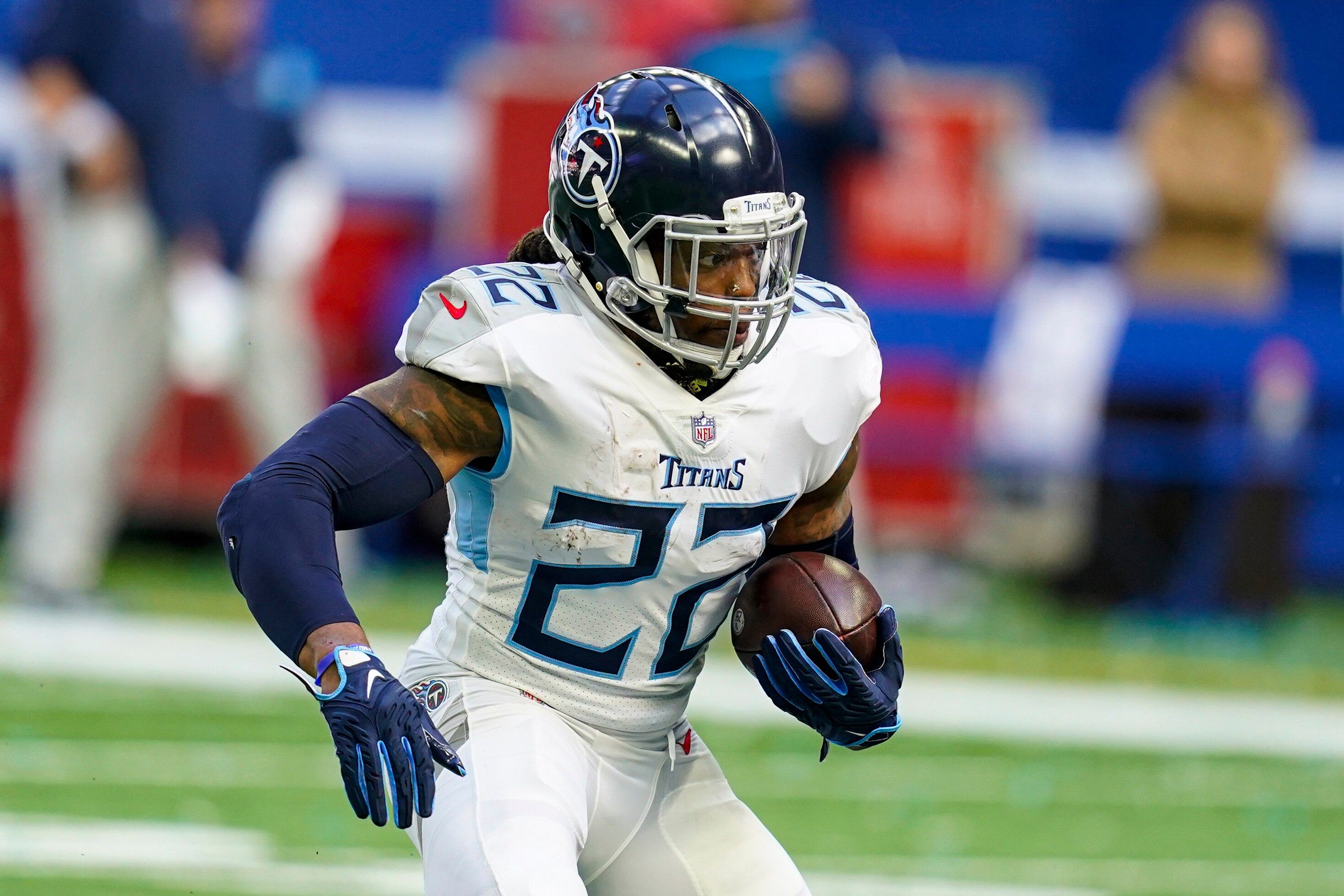 FILE - Tennessee Titans running back Derrick Henry runs against the Indianapolis Colts in an NFL football game in Indianapolis on Sunday, Oct. 31, 2021. The Titans have moved a step closer to having the 2020 AP NFL Offensive Player of the Year back, opening the 21-day window Wednesday, Jan. 5, 2022, for Derrick Henry to start practicing. (AP Photo/Darron Cummings, File)