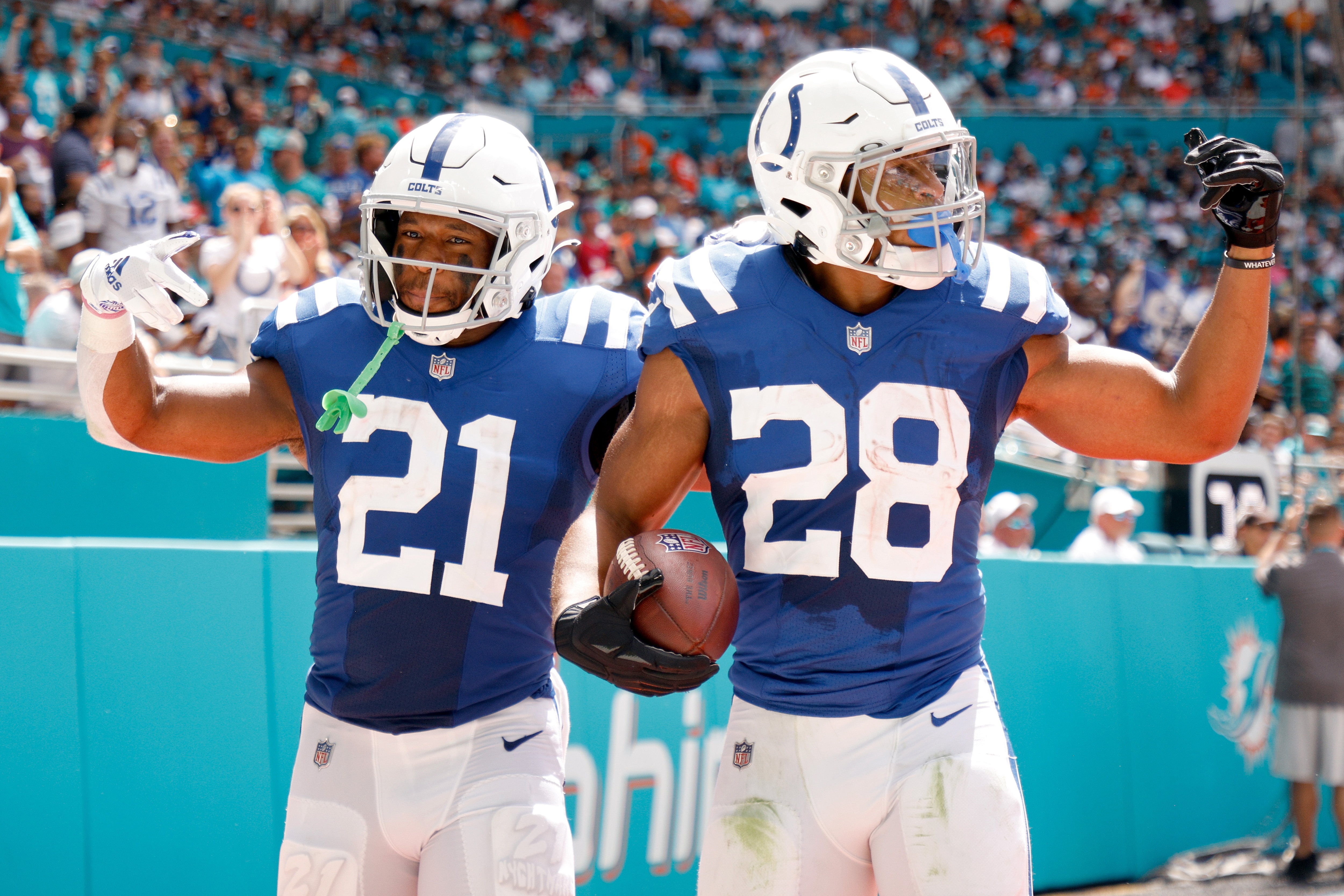 MIAMI GARDENS, FLORIDA - OCTOBER 03: Jonathan Taylor #28 and Nyheim Hines #21 of the Indianapolis Colts celebrates a touchdown during the second quarter in the game against the Miami Dolphins at Hard Rock Stadium on October 03, 2021 in Miami Gardens, Florida. (Photo by Cliff Hawkins/Getty Images)