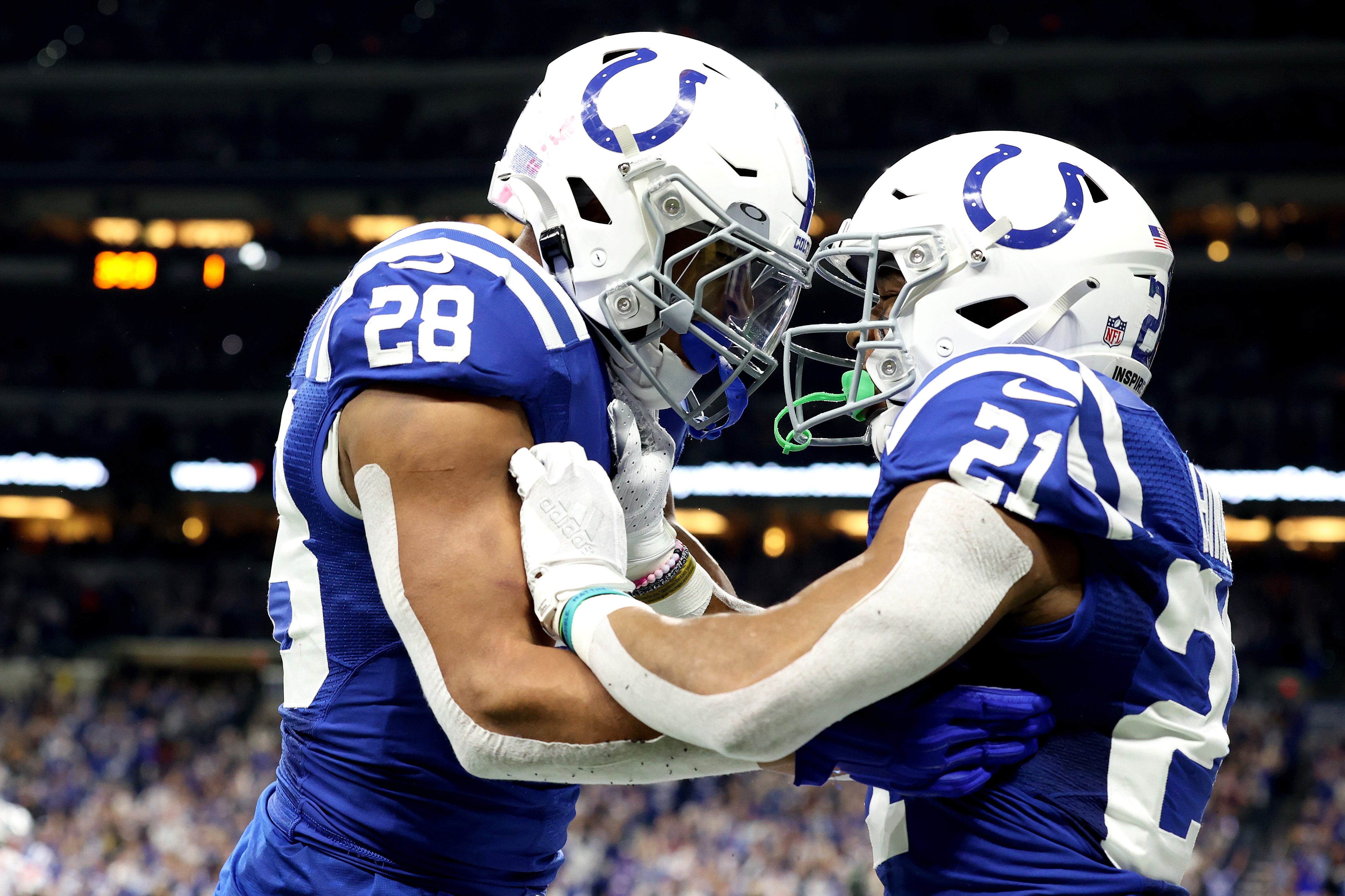INDIANAPOLIS, INDIANA - DECEMBER 18: Jonathan Taylor #28 of the Indianapolis Colts and Nyheim Hines #21 of the Indianapolis Colts celebrate after a touchdown against the New England Patriots during the first quarter at Lucas Oil Stadium on December 18, 2021 in Indianapolis, Indiana. (Photo by Andy Lyons/Getty Images)