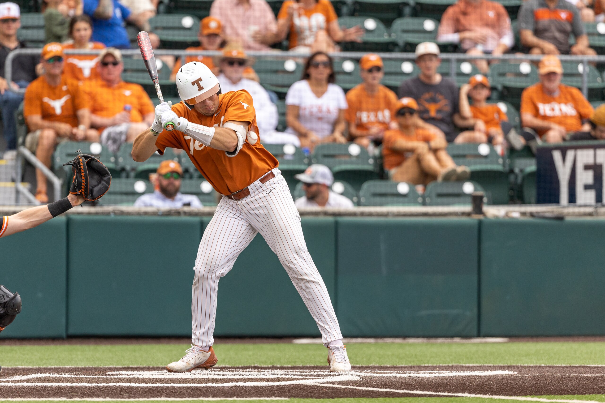 AUSTIN, TX - MAY 01: Texas Longhorns infielder Ivan Melendez (17) is hit by a pitch during the game between Texas Longhorns and Oklahoma State Cowboys on May 1, 2022, at UFCU Disch-Falk Field in Austin, TX. (Photo by David Buono/Icon Sportswire via Getty Images)