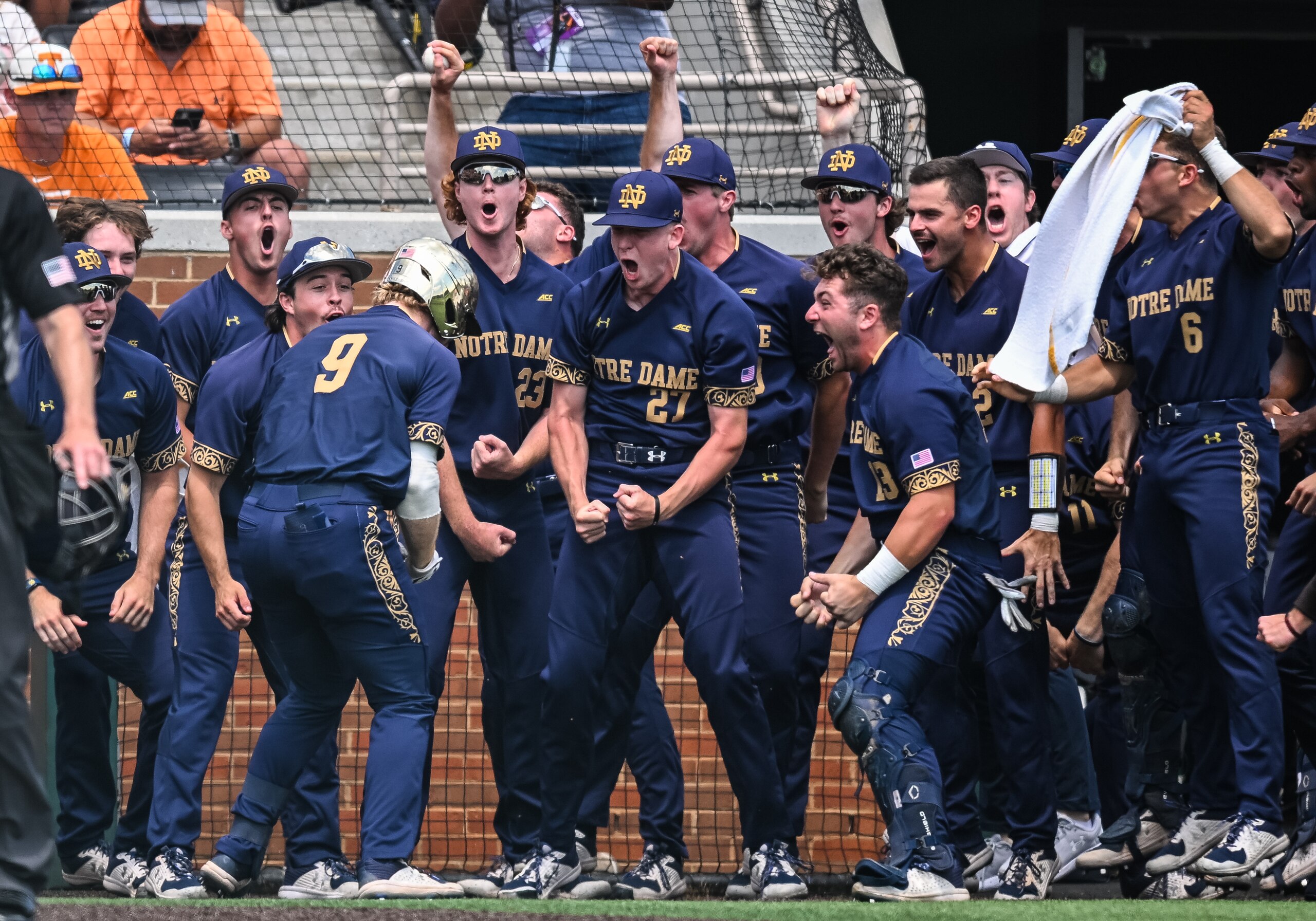 KNOXVILLE, TN - JUNE 12: Notre Dame utility Jack Brannigan (9) celebrates with teammates after a home run during game three of the NCAA Super Regionals between the Tennessee Volunteers and Notre Dame Fighting Irish on June 12, 2022, at Lindsey Nelson Stadium in Knoxville, TN. (Photo by Bryan Lynn/Icon Sportswire via Getty Images)