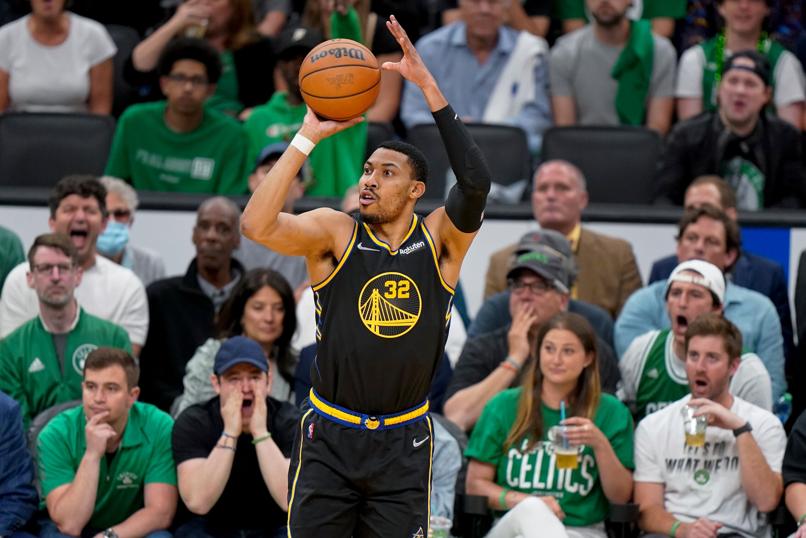 Golden State Warriors forward Otto Porter Jr. (32) puts up a shot against the Boston Celtics during the second quarter of Game 3 of basketball's NBA Finals, Wednesday, June 8, 2022, in Boston. (AP Photo/Steven Senne)
