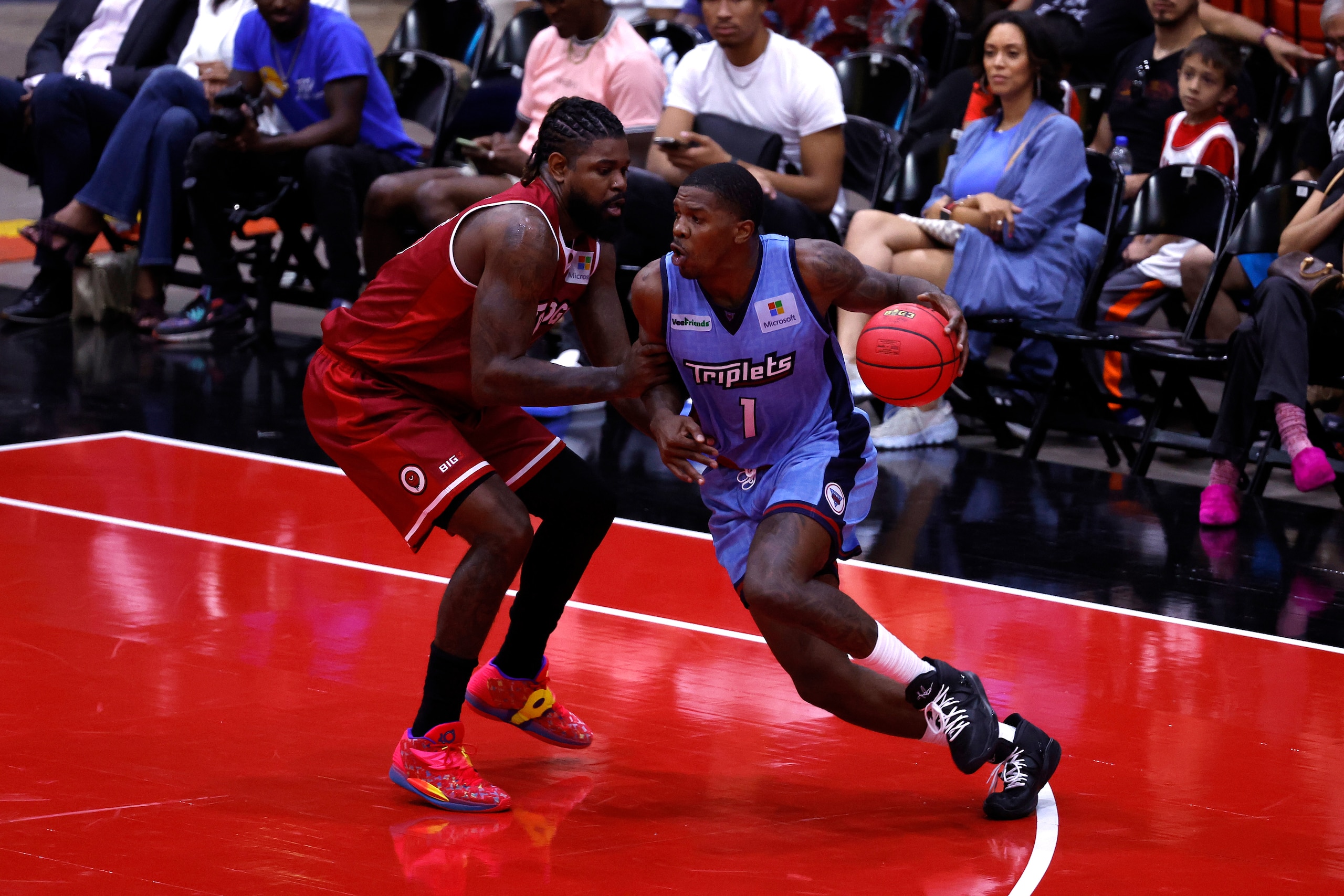 CHICAGO, ILLINOIS - JUNE 18: Joe Johnson #1 of the Triplets drives against Amir Johnson #15 of the Trilogy during Week One at Credit Union 1 Arena on June 18, 2022 in Chicago, Illinois. (Photo by Kirk Irwin/Getty Images for BIG3)