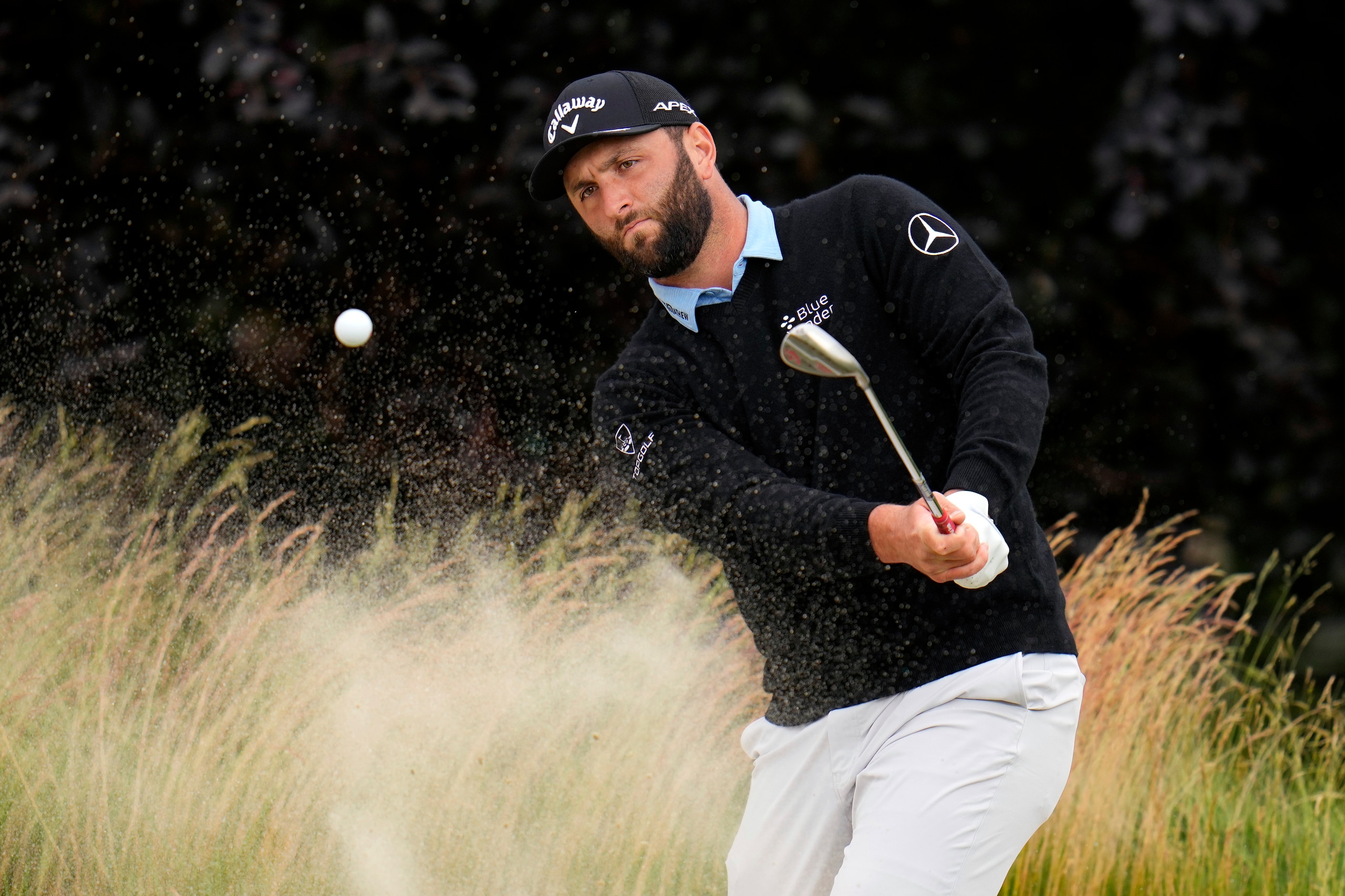 Jon Rahm, of Spain, hits on the fifth hole during the third round of the U.S. Open golf tournament at The Country Club, Saturday, June 18, 2022, in Brookline, Mass. (AP Photo/Julio Cortez)