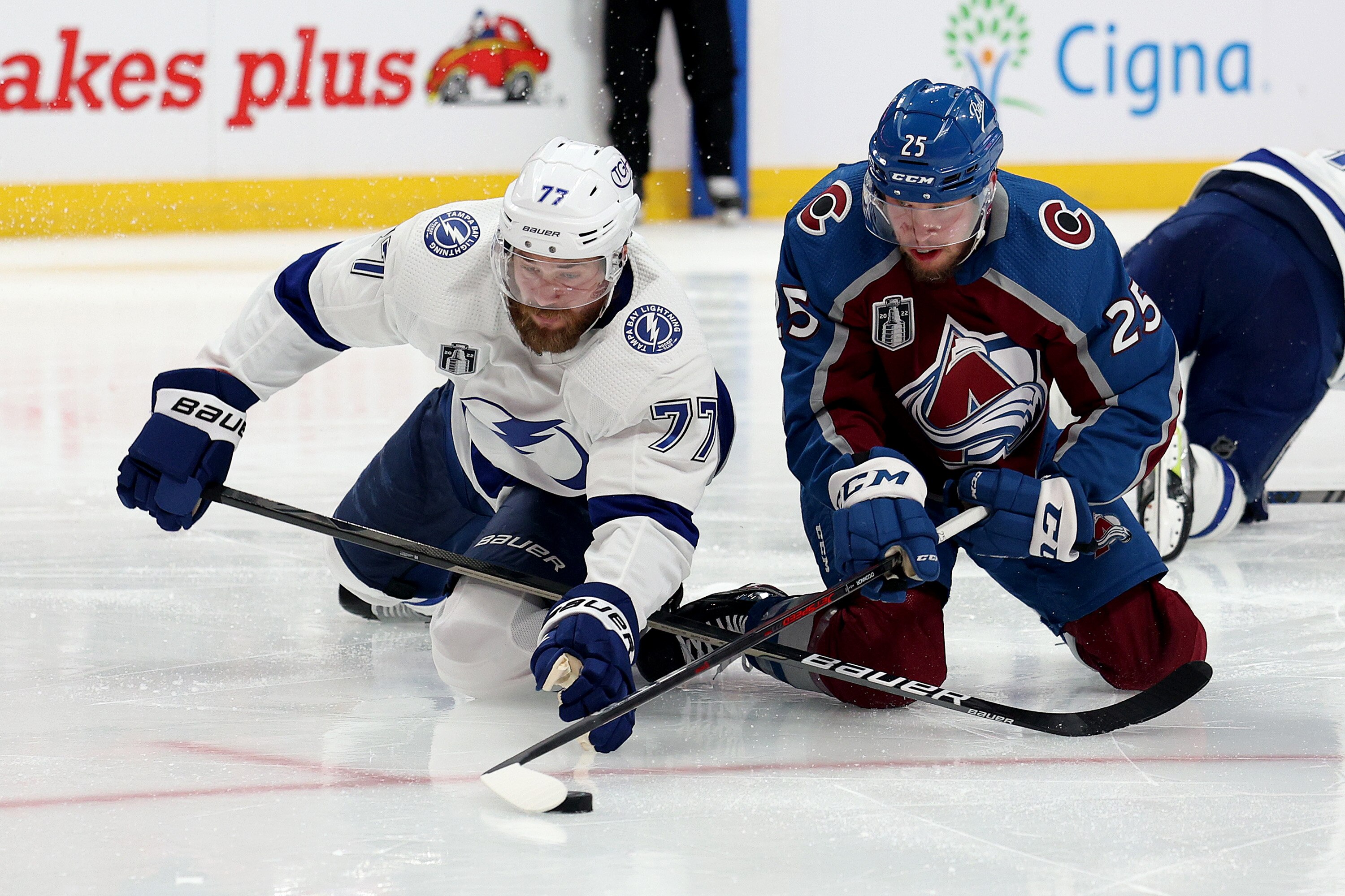 DENVER, COLORADO - JUNE 18: Victor Hedman #77 of the Tampa Bay Lightning and Logan O'Connor #25 of the Colorado Avalanche fight for the puck during the second period in Game Two of the 2022 NHL Stanley Cup Final at Ball Arena on June 18, 2022 in Denver, Colorado. (Photo by Harry How/Getty Images)