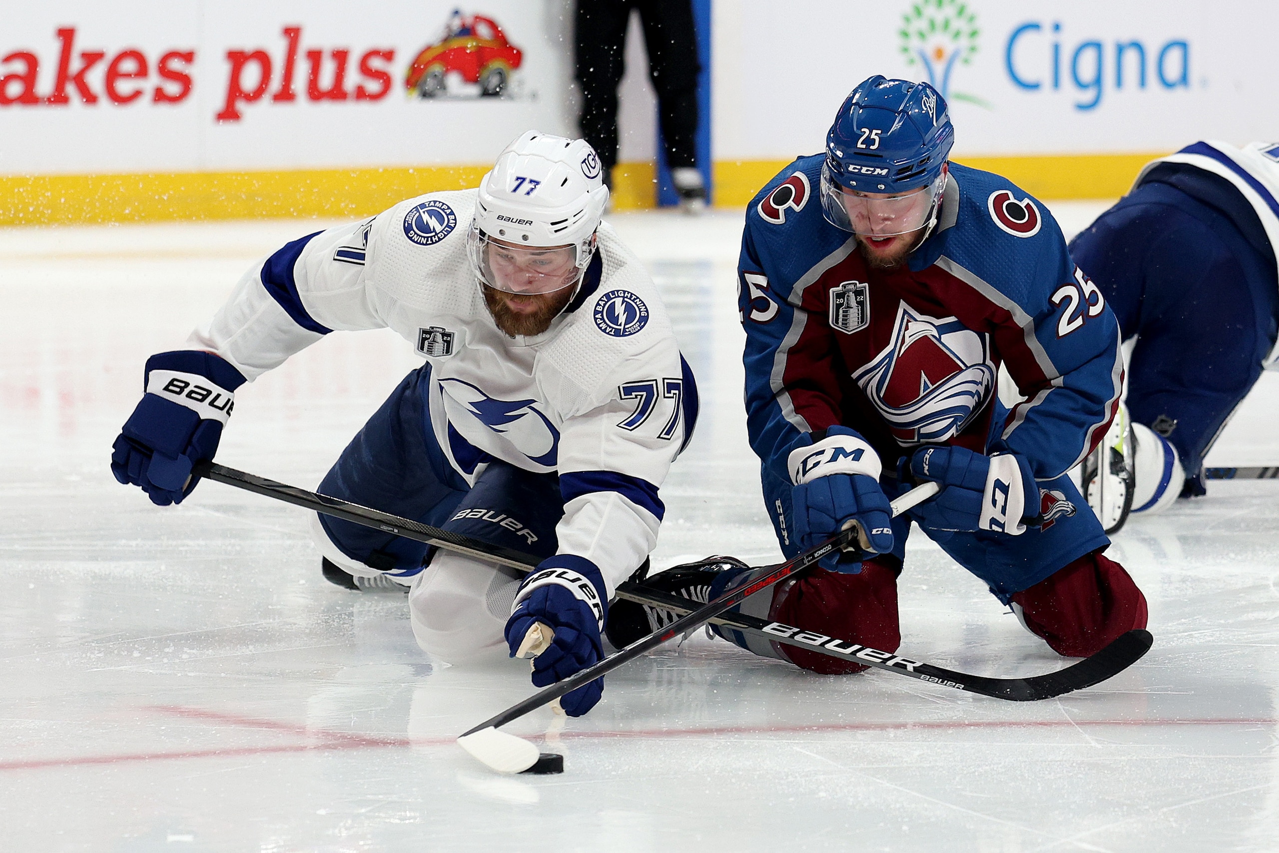 DENVER, COLORADO - JUNE 18: Victor Hedman #77 of the Tampa Bay Lightning and Logan O'Connor #25 of the Colorado Avalanche fight for the puck during the second period in Game Two of the 2022 NHL Stanley Cup Final at Ball Arena on June 18, 2022 in Denver, Colorado. (Photo by Harry How/Getty Images)