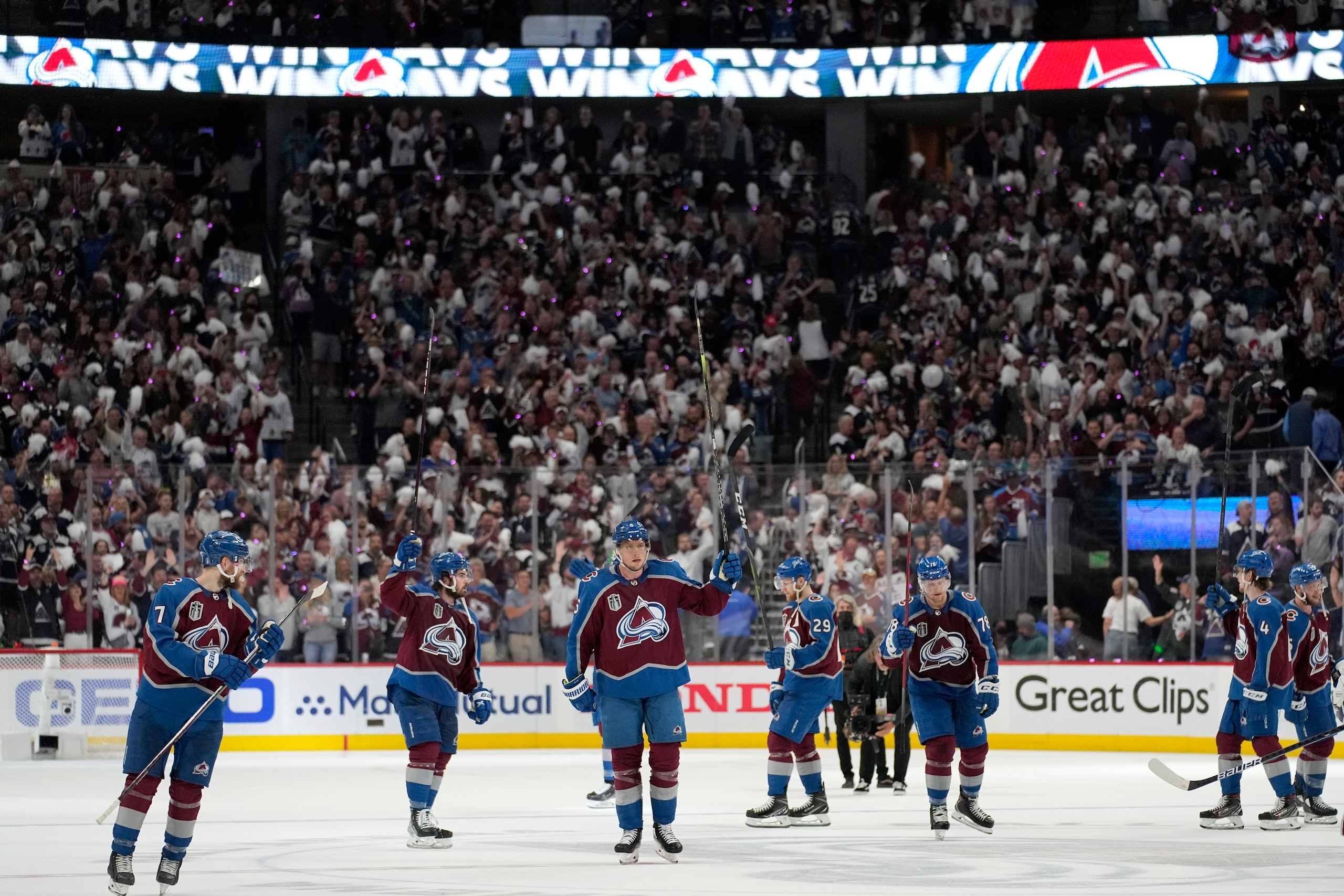Colorado Avalanche players celebrate after the Avalanche defeated the Tampa Bay Lightning 7-0 in Game 2 of the NHL hockey Stanley Cup Final, Saturday, June 18, 2022, in Denver. (AP Photo/John Locher)