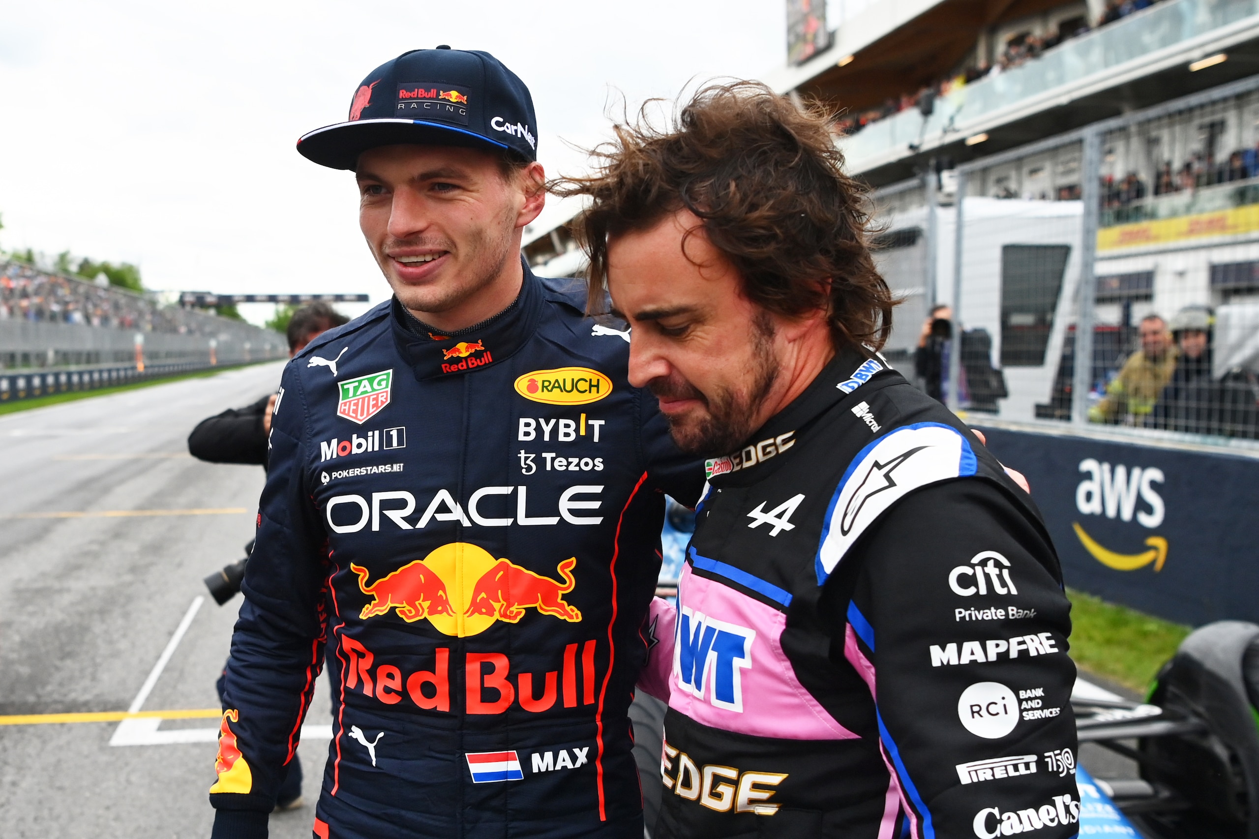 MONTREAL, QUEBEC - JUNE 18: Pole position qualifier Max Verstappen of the Netherlands and Oracle Red Bull Racing talks with Second placed qualifier Fernando Alonso of Spain and Alpine F1 in parc ferme during qualifying ahead of the F1 Grand Prix of Canada at Circuit Gilles Villeneuve on June 18, 2022 in Montreal, Quebec. (Photo by Dan Mullan/Getty Images)