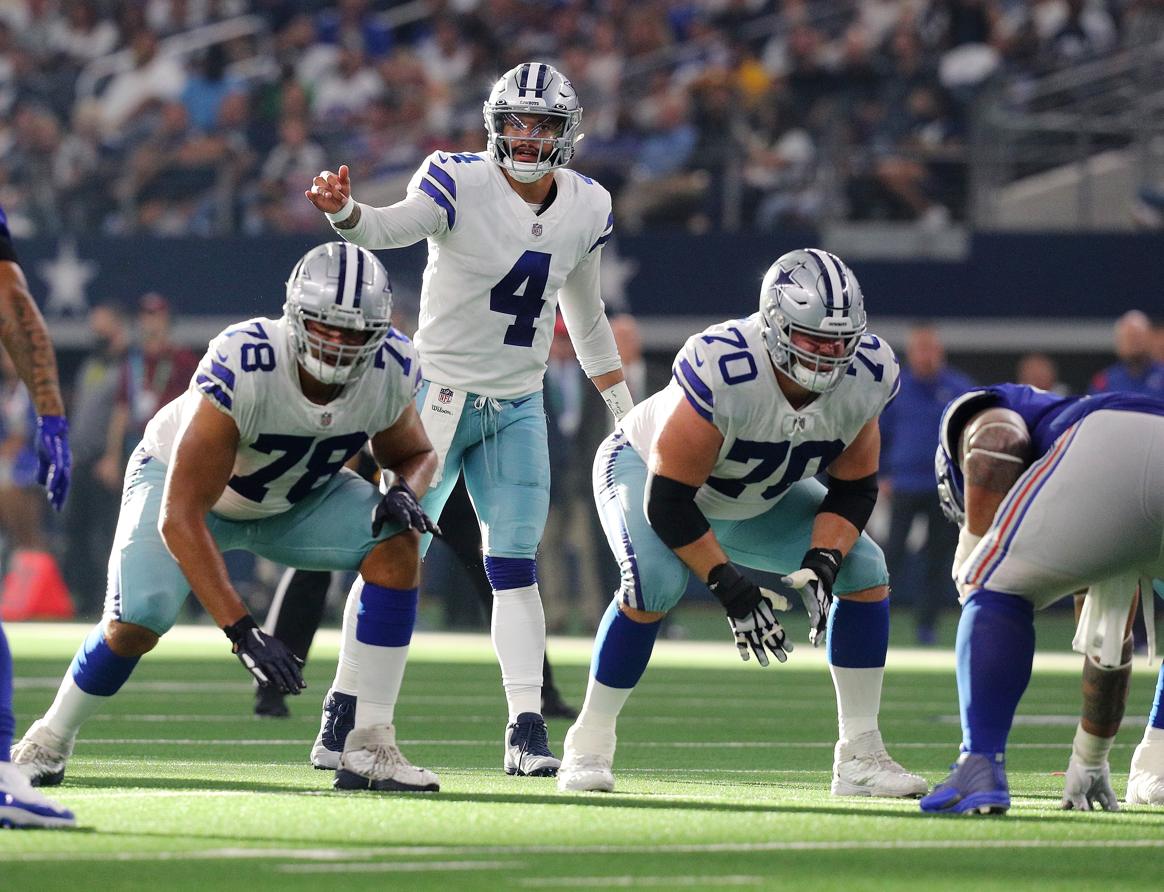 ARLINGTON, TEXAS - OCTOBER 10: Terence Steele #78, Dak Prescott #4, and Zack Martin #70 of the Dallas Cowboys line up against the New York Giants at AT&T Stadium on October 10, 2021 in Arlington, Texas. (Photo by Richard Rodriguez/Getty Images)