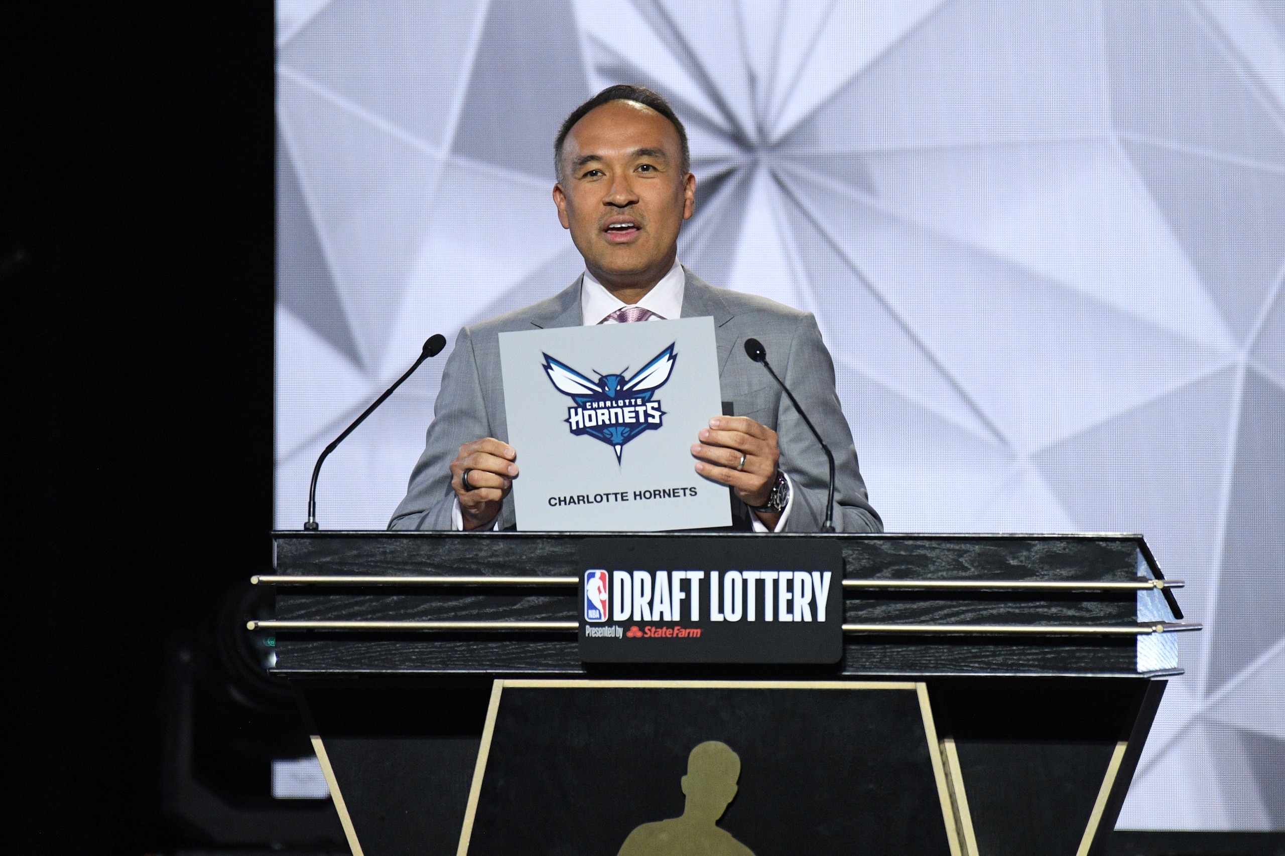 CHICAGO,IL - MAY 17: Deputy Commissioner of the NBA, Mark Tatum announces the Charlotte Hornets as the 13th overall pick for the NBA Draft during the 2022 NBA Draft Lottery at McCormick Place on May 17, 2022 in Chicago, Illinois. NOTE TO USER: User expressly acknowledges and agrees that, by downloading and or using this photograph, User is consenting to the terms and conditions of the Getty Images License Agreement. Mandatory Copyright Notice: Copyright 2022 NBAE (Photo by Chris Schwegler/NBAE via Getty Images)