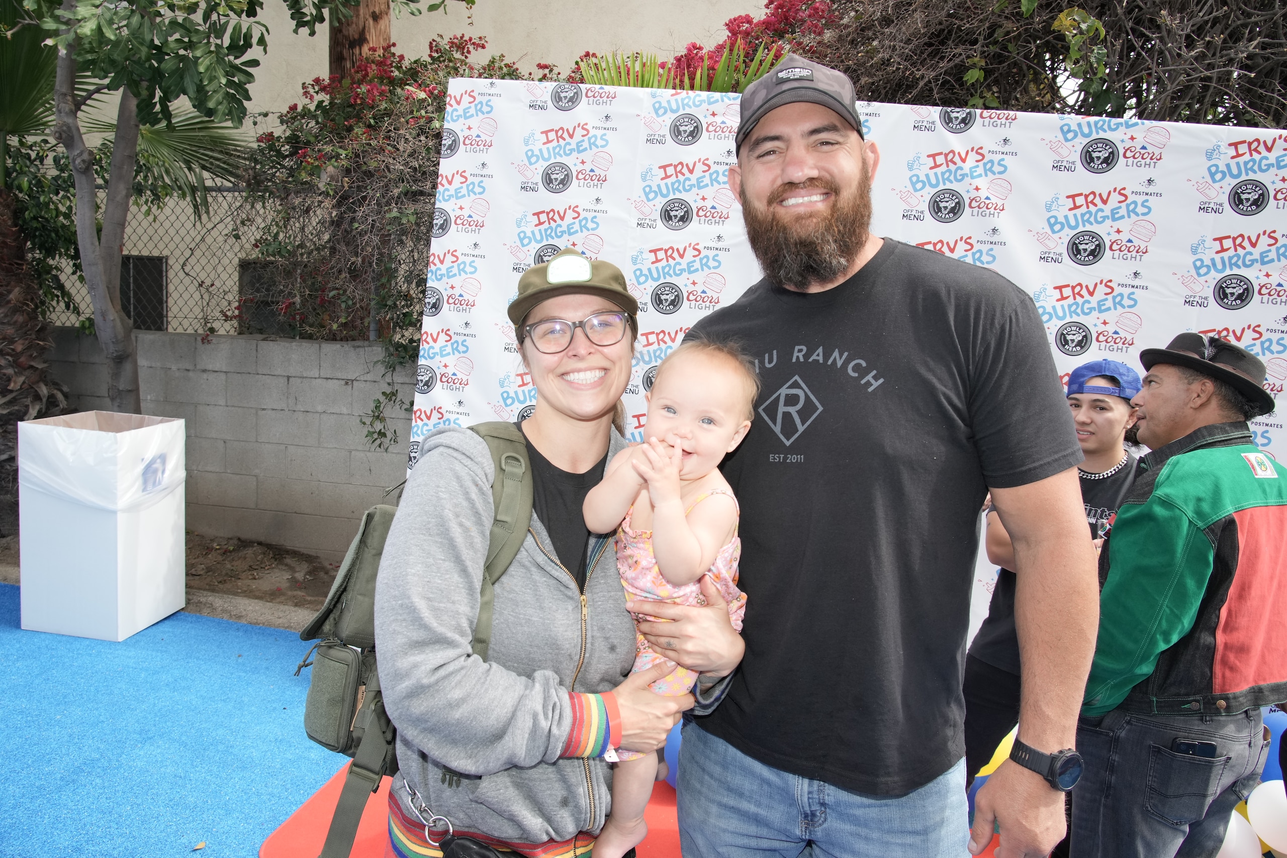 LOS ANGELES, CALIFORNIA - MAY 28: Ronda Rousey, La'akea Makalapuaokalanipo Browne and Travis Browne celebrate National Burger Day at the friends and family preview party for the new Irv's Burgers on May 28, 2022 in Los Angeles, California. (Photo by Jeff Kravitz/FilmMagic)