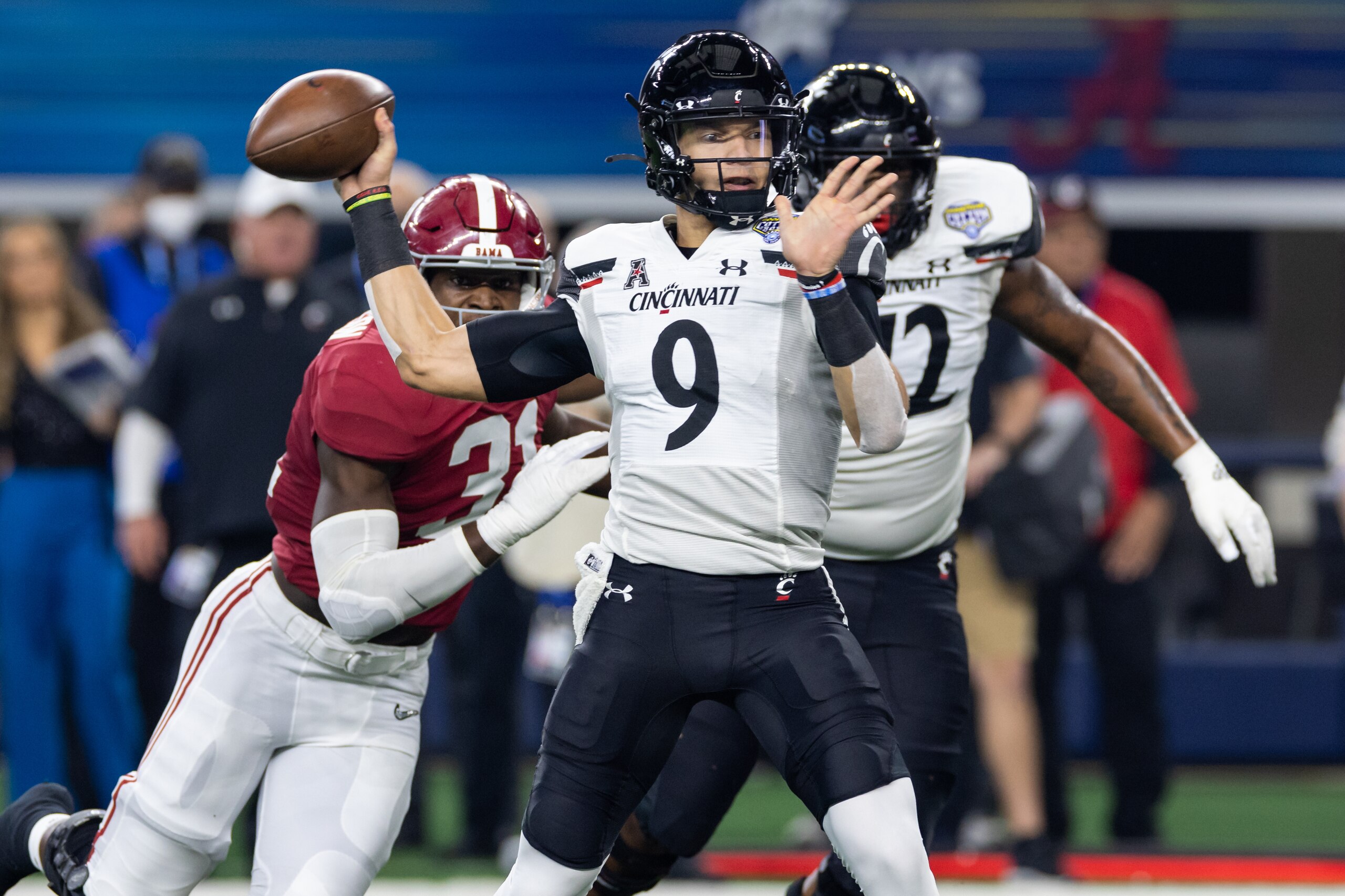 ARLINGTON, TX - DECEMBER 31: Cincinnati Bearcats quarterback Desmond Ridder (#9) throws a pass during the Goodyear Cotton Bowl CFP Semifinal college football game between the Alabama Crimson Tide and the Cincinnati Bearcats on December 31, 2021 at AT&T Stadium in Arlington, Texas.  (Photo by Matthew Visinsky/Icon Sportswire via Getty Images)