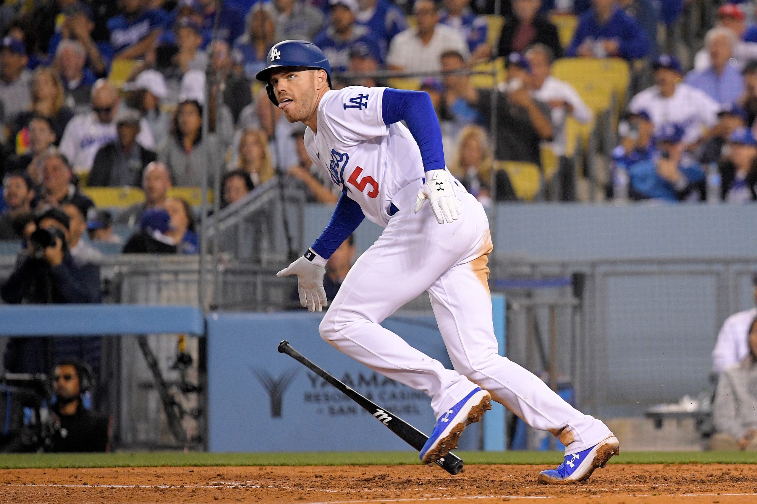 Los Angeles Dodgers' Freddie Freeman drops his bat as he hits an RBI double during the fifth inning of a baseball game against the Arizona Diamondbacks Monday, May 16, 2022, in Los Angeles. (AP Photo/Mark J. Terrill)