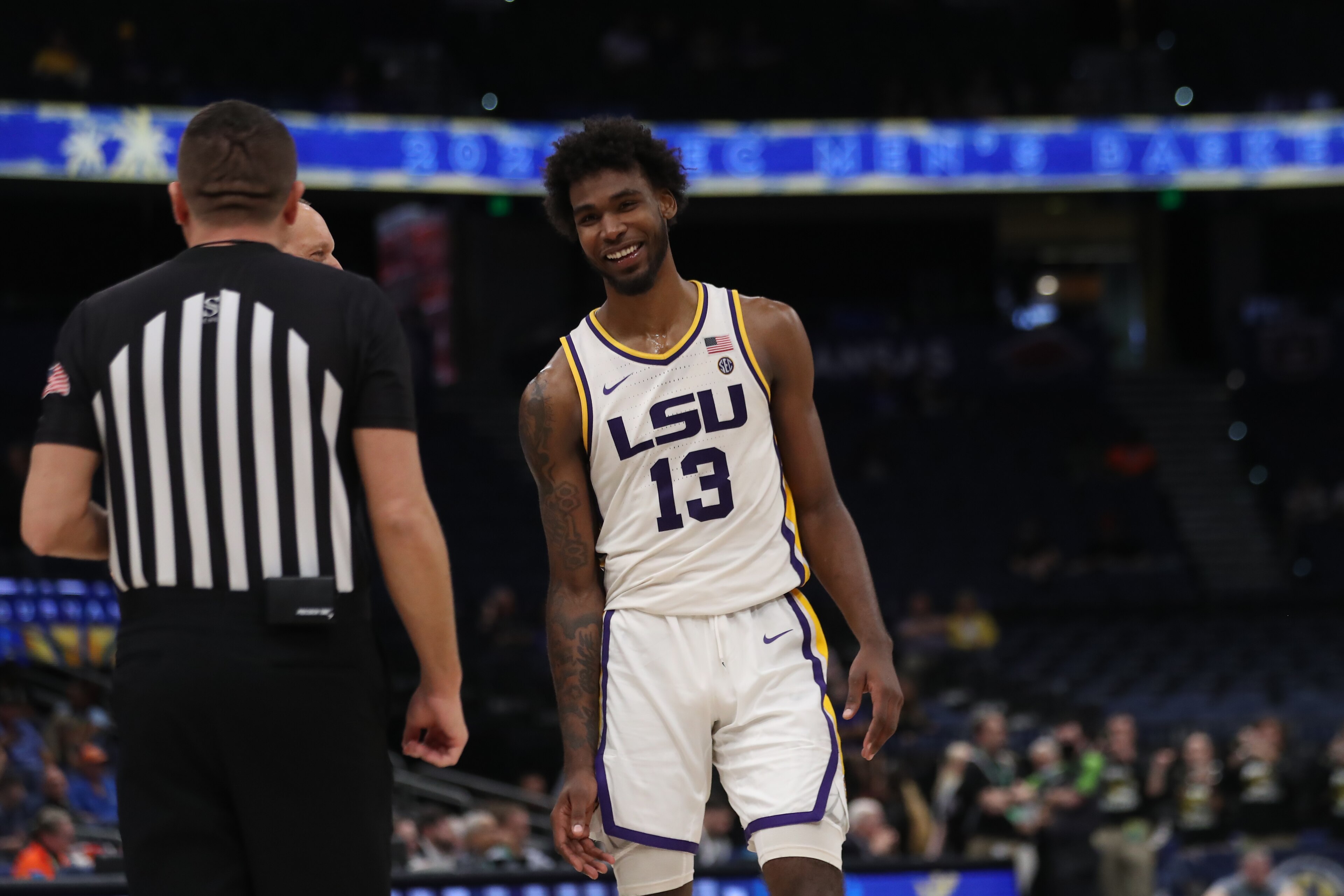 TAMPA, FL - MARCH 10: LSU Tigers forward Tari Eason (13) stars a laugh with an official during the SEC Tournament between the Missouri Tigers and the LSU Tigers on Thursday, March 10, 2022, at the Amalie Arena in Tampa, FL. (Photo by Peter Joneleit/Icon Sportswire via Getty Images) TAMPA, FL - MARCH 10: LSU Tigers forward Tari Eason (13) stars a laugh with an official during the SEC Tournament between the Missouri Tigers and the LSU Tigers on Thursday, March 10, 2022, at the Amalie Arena in Tampa, FL. (Photo by Peter Joneleit/Icon Sportswire via Getty Images)
