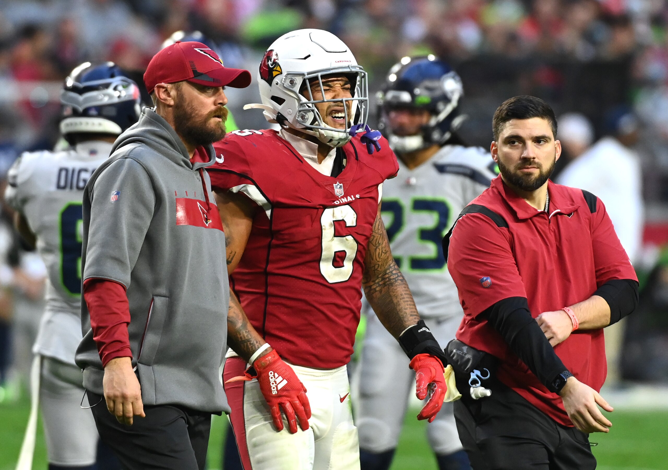 GLENDALE, ARIZONA - JANUARY 09: James Conner #6 of the Arizona Cardinals reacts as he is helped off the field after being injured on a play during the fourth quarter against the Seattle Seahawks at State Farm Stadium on January 09, 2022 in Glendale, Arizona. (Photo by Norm Hall/Getty Images) GLENDALE, ARIZONA - JANUARY 09: James Conner #6 of the Arizona Cardinals reacts as he is helped off the field after being injured on a play during the fourth quarter against the Seattle Seahawks at State Farm Stadium on January 09, 2022 in Glendale, Arizona. (Photo by Norm Hall/Getty Images)