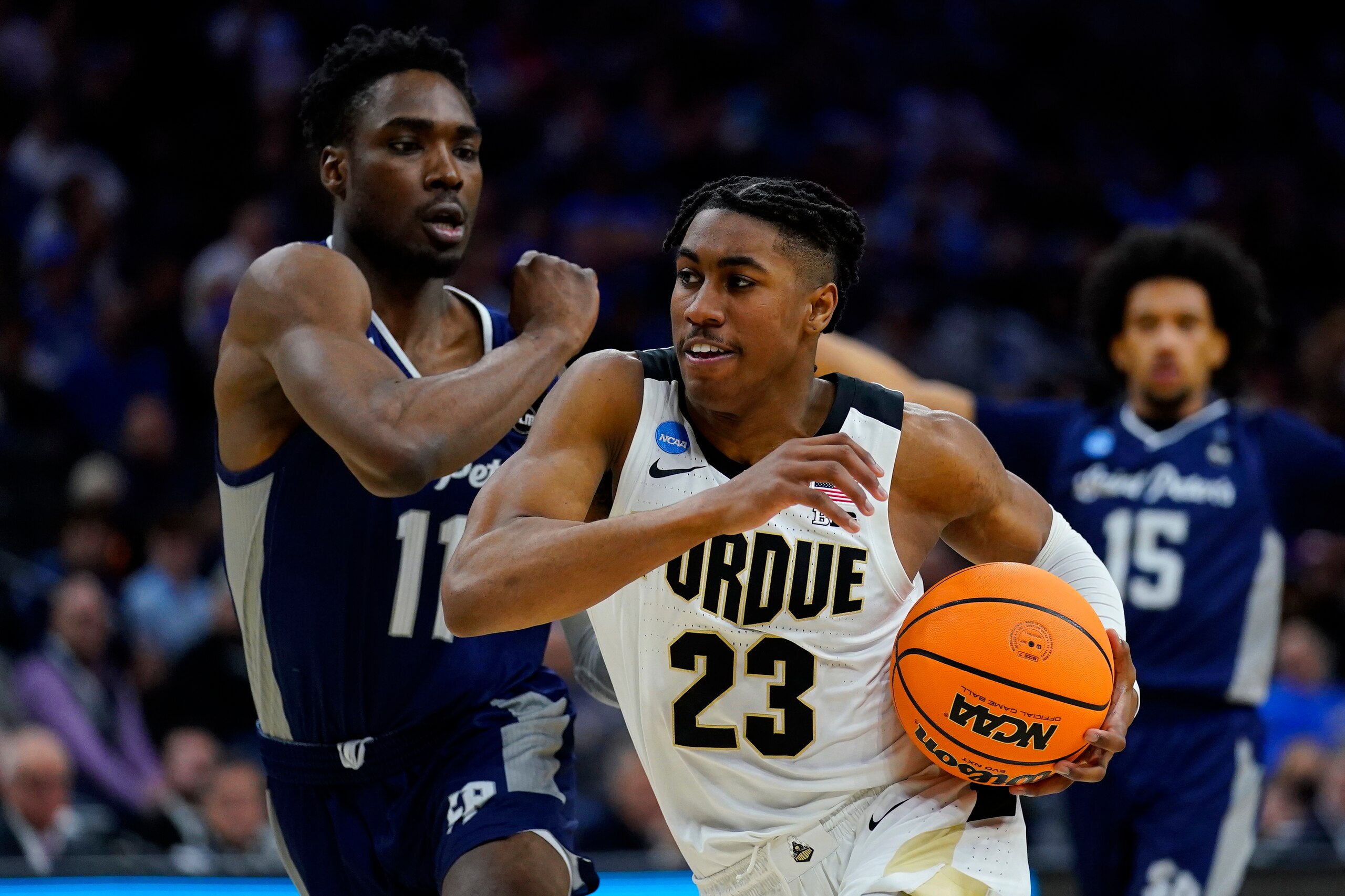 Purdue's Jaden Ivey (23) drives past Saint Peter's KC Ndefo (11) during the second half of a college basketball game in the Sweet 16 round of the NCAA tournament, Friday, March 25, 2022, in Philadelphia. (AP Photo/Matt Rourke) Purdue's Jaden Ivey (23) drives past Saint Peter's KC Ndefo (11) during the second half of a college basketball game in the Sweet 16 round of the NCAA tournament, Friday, March 25, 2022, in Philadelphia. (AP Photo/Matt Rourke)