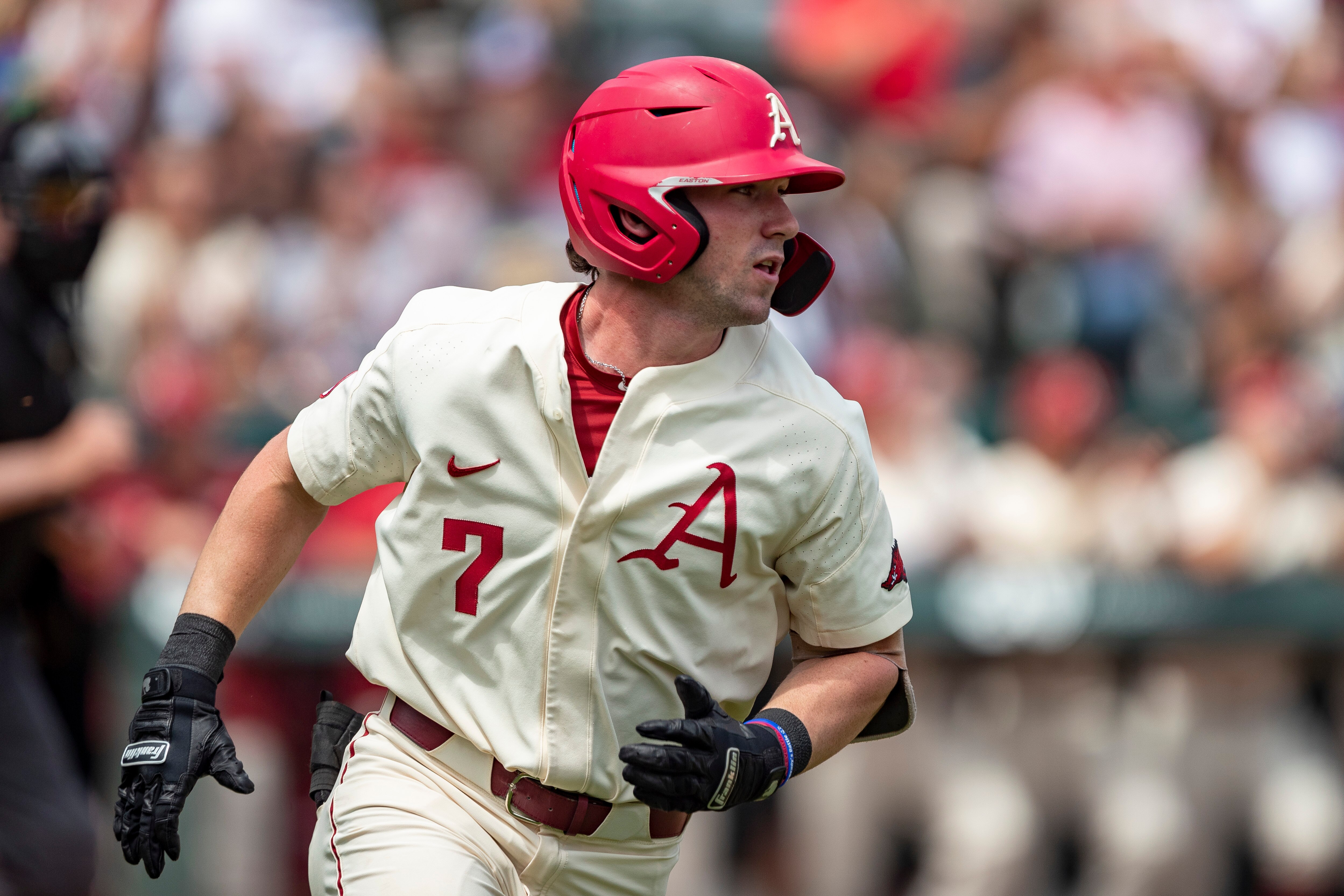 FAYETTEVILLE, ARKANSAS - MAY 22: Cayden Wallace #7 of the Arkansas Razorbacks runs to first base during a game against the Florida Gators at Baum-Walker Stadium at George Cole Field on May 22, 2021 in Fayetteville, Arkansas. The Razorbacks defeated the Gators to sweep the series 9-3.  (Photo by Wesley Hitt/Getty Images)