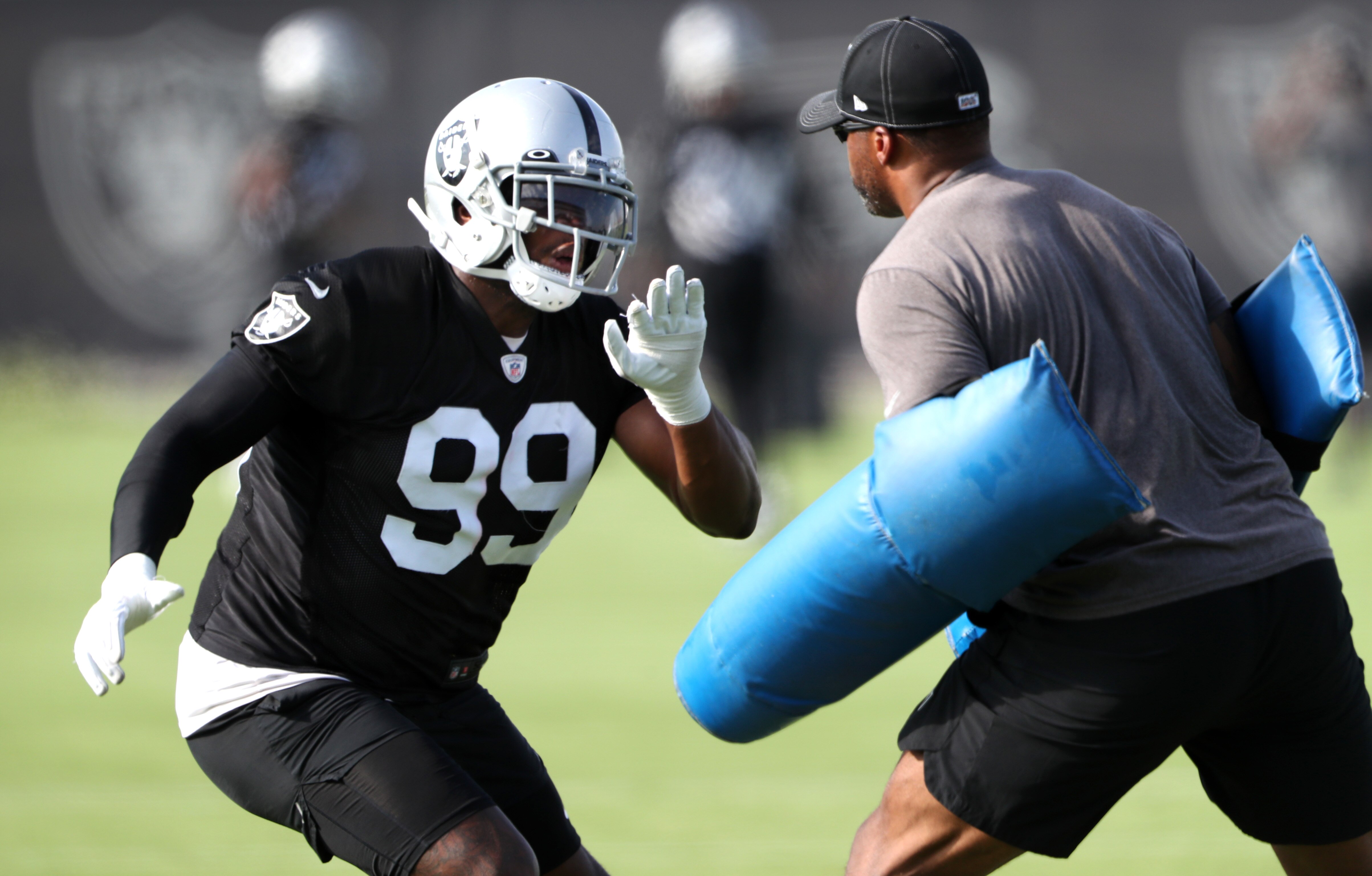 HENDERSON, NEVADA - JULY 29: Clelin Ferrell #99 of the Las Vegas Raiders runs a drill during training camp at the Las Vegas Raiders Headquarters/Intermountain Healthcare Performance Center on July 29, 2021 in Henderson, Nevada. (Photo by Steve Marcus/Getty Images)