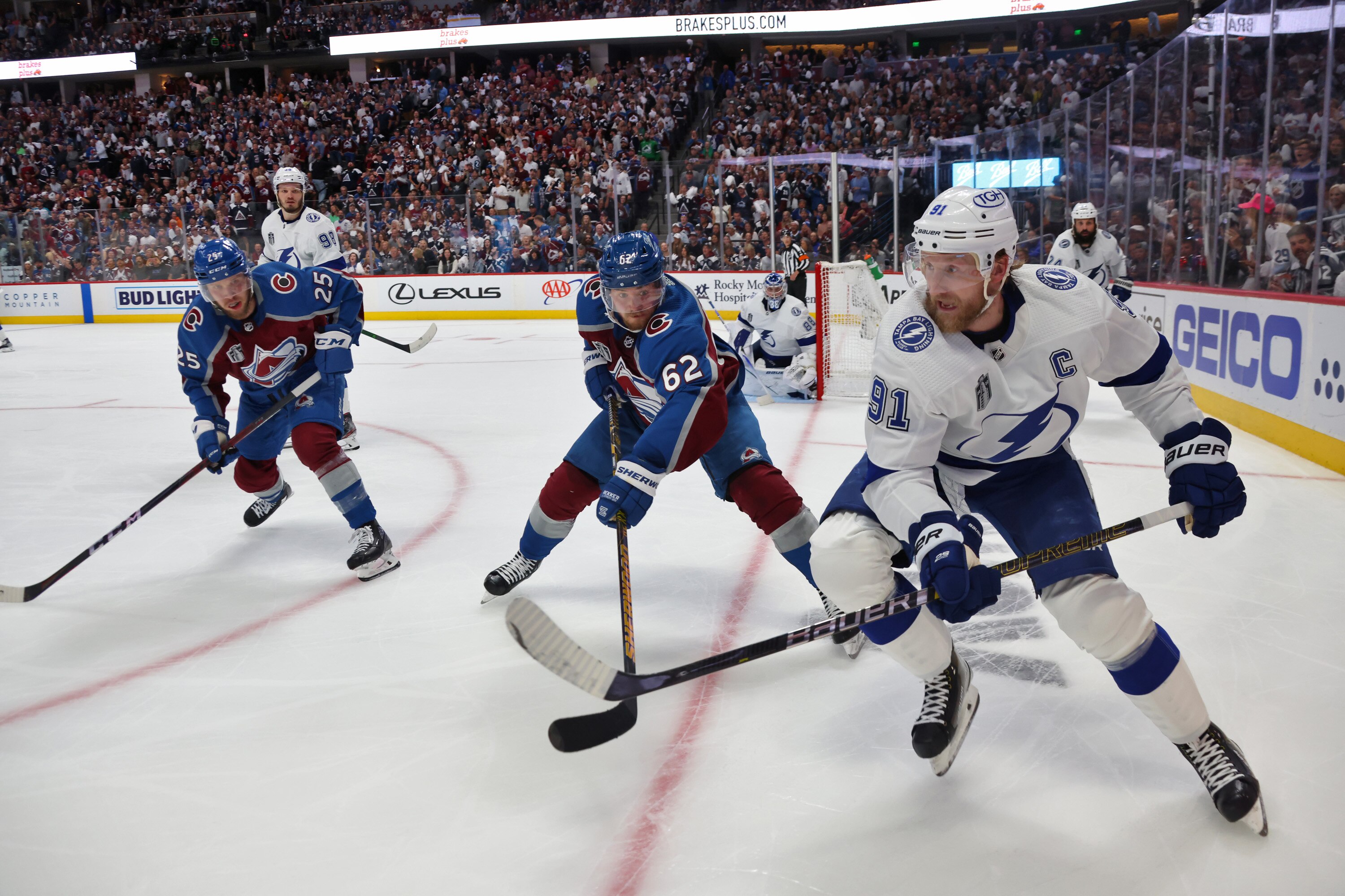 DENVER, COLORADO - JUNE 18: Steven Stamkos #91 of the Tampa Bay Lightning skates into the corner against Artturi Lehkonen #62 and Logan O'Connor #25 of the Colorado Avalanche during the third period of Game Two of the 2022 Stanley Cup Final at Ball Arena on June 18, 2022 in Denver, Colorado. (Photo by Dave Sandford/NHLI via Getty Images) DENVER, COLORADO - JUNE 18: Steven Stamkos #91 of the Tampa Bay Lightning skates into the corner against Artturi Lehkonen #62 and Logan O'Connor #25 of the Colorado Avalanche during the third period of Game Two of the 2022 Stanley Cup Final at Ball Arena on June 18, 2022 in Denver, Colorado. (Photo by Dave Sandford/NHLI via Getty Images)