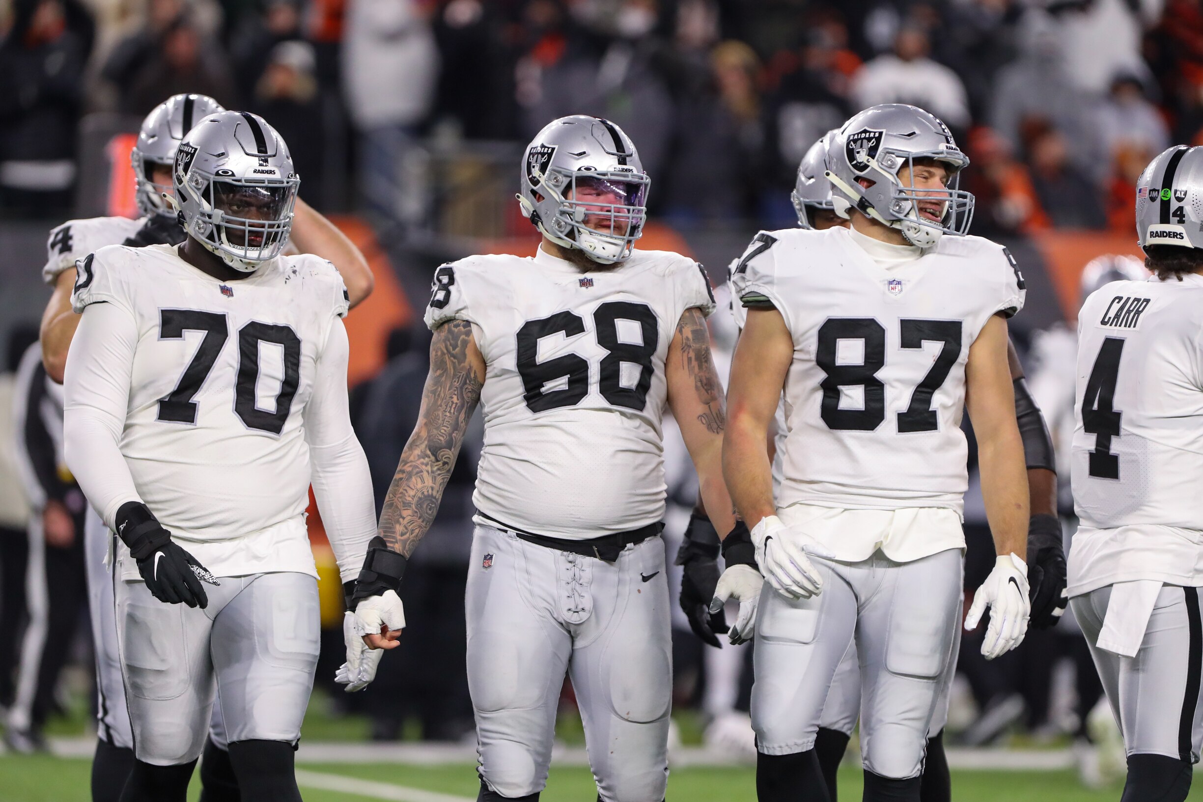 CINCINNATI, OH - JANUARY 15: Las Vegas Raiders players guard Alex Leatherwood (70), center Andre James (68) and tight end Foster Moreau (87) during the Wild Card game against the Las Vegas Raiders and the Cincinnati Bengals on January 15, 2022, at Paul Brown Stadium in Cincinnati, OH. (Photo by Ian Johnson/Icon Sportswire via Getty Images)