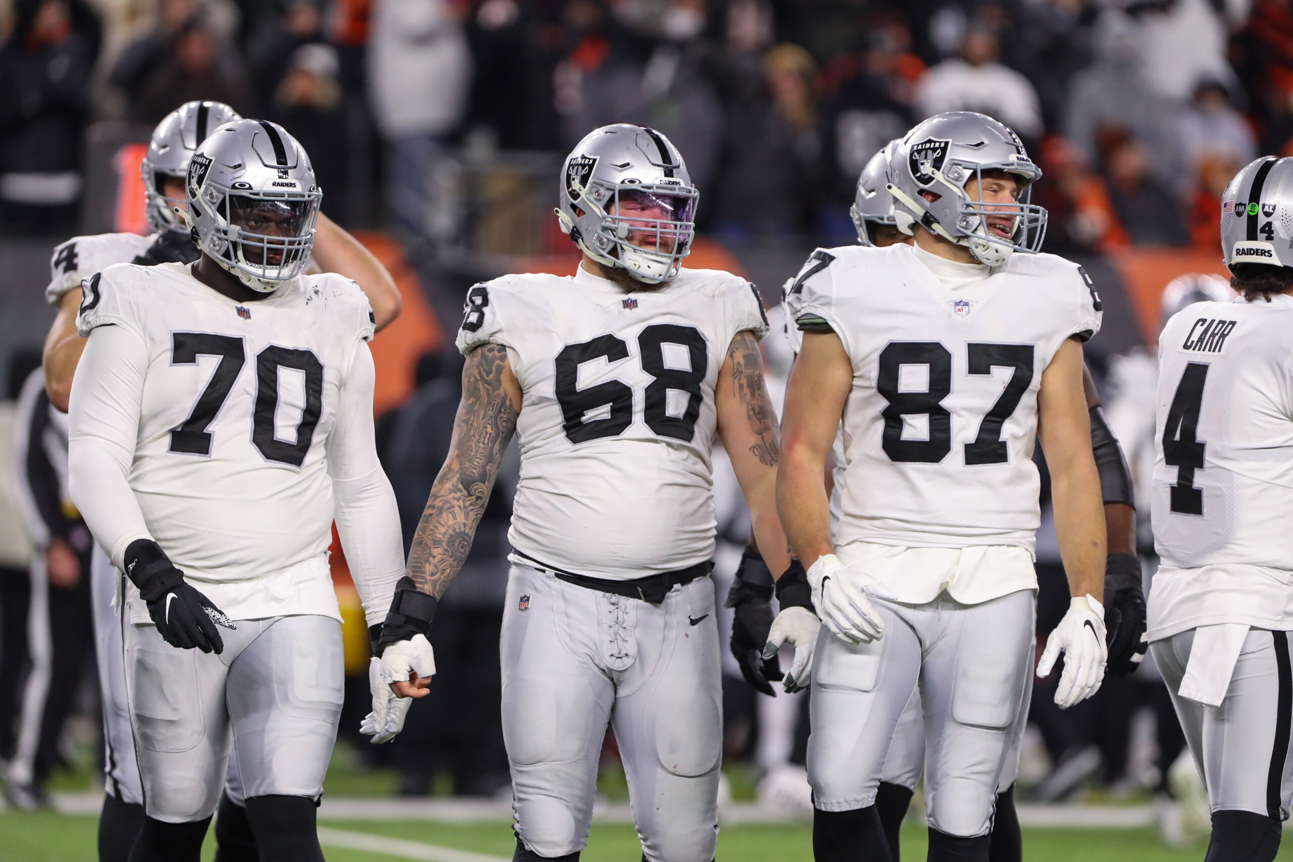 CINCINNATI, OH - JANUARY 15: Las Vegas Raiders players guard Alex Leatherwood (70), center Andre James (68) and tight end Foster Moreau (87) during the Wild Card game against the Las Vegas Raiders and the Cincinnati Bengals on January 15, 2022, at Paul Brown Stadium in Cincinnati, OH. (Photo by Ian Johnson/Icon Sportswire via Getty Images) CINCINNATI, OH - JANUARY 15: Las Vegas Raiders players guard Alex Leatherwood (70), center Andre James (68) and tight end Foster Moreau (87) during the Wild Card game against the Las Vegas Raiders and the Cincinnati Bengals on January 15, 2022, at Paul Brown Stadium in Cincinnati, OH. (Photo by Ian Johnson/Icon Sportswire via Getty Images)