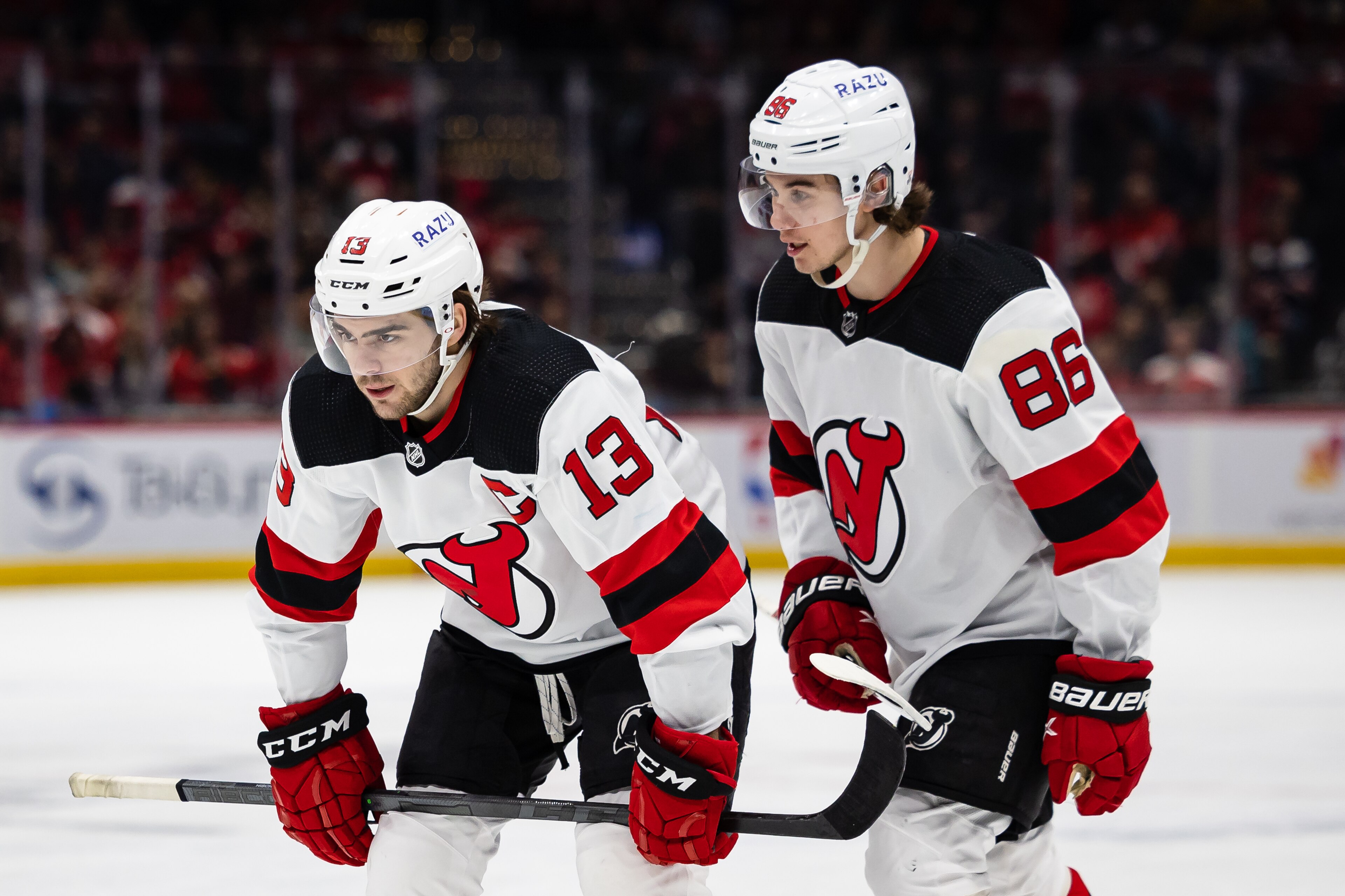 WASHINGTON, DC - March 26: Nico Hischier #13 and Jack Hughes #86 of the New Jersey Devils prepare for a face-off against the Washington Capitals during the first period of the game at Capital One Arena on March 26, 2022 in Washington, DC. (Photo by Scott Taetsch/Getty Images) WASHINGTON, DC - March 26: Nico Hischier #13 and Jack Hughes #86 of the New Jersey Devils prepare for a face-off against the Washington Capitals during the first period of the game at Capital One Arena on March 26, 2022 in Washington, DC. (Photo by Scott Taetsch/Getty Images)