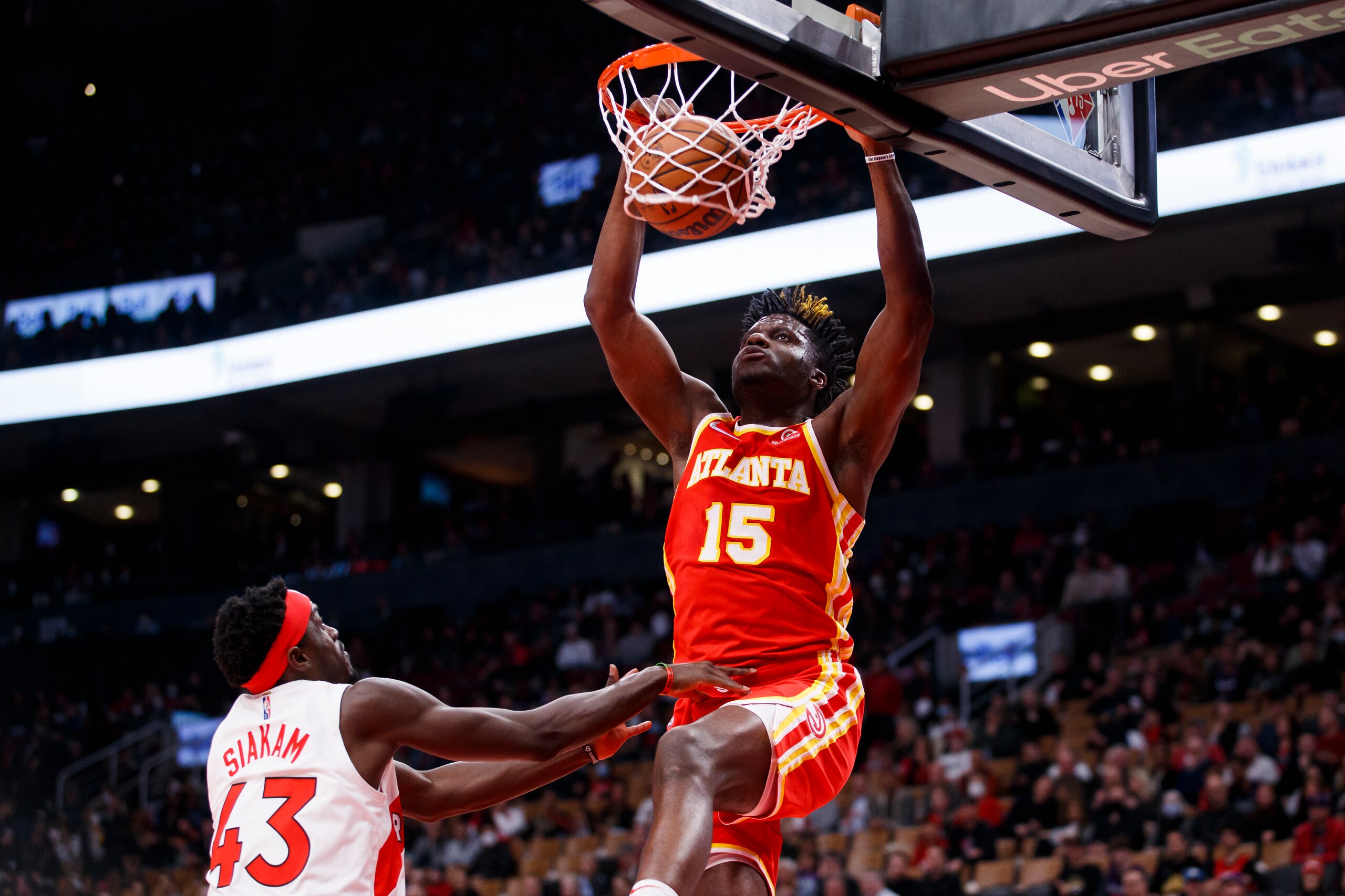 TORONTO, ON - APRIL 05: Clint Capela #15 of the Atlanta Hawks dunks on Pascal Siakam #43 of the Toronto Raptors during the first half of their NBA game at Scotiabank Arena on April 5, 2022 in Toronto, Canada. NOTE TO USER: User expressly acknowledges and agrees that, by downloading and or using this Photograph, user is consenting to the terms and conditions of the Getty Images License Agreement. (Photo by Cole Burston/Getty Images)
