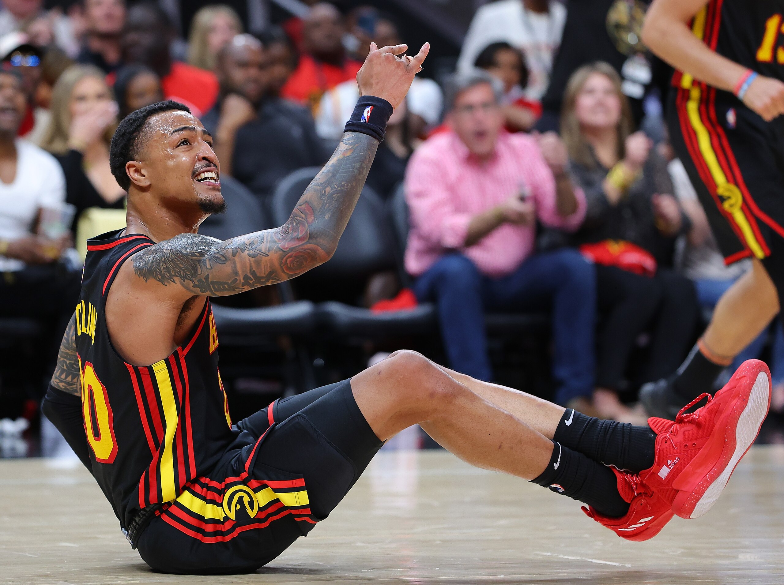ATLANTA, GEORGIA - APRIL 24:  John Collins #20 of the Atlanta Hawks reacts after being fouled by the Miami Heat during the second half in Game Four of the Eastern Conference First Round at State Farm Arena on April 24, 2022 in Atlanta, Georgia. NOTE TO USER: User expressly acknowledges and agrees that, by downloading and or using this photograph, User is consenting to the terms and conditions of the Getty Images License Agreement.  (Photo by Kevin C. Cox/Getty Images)