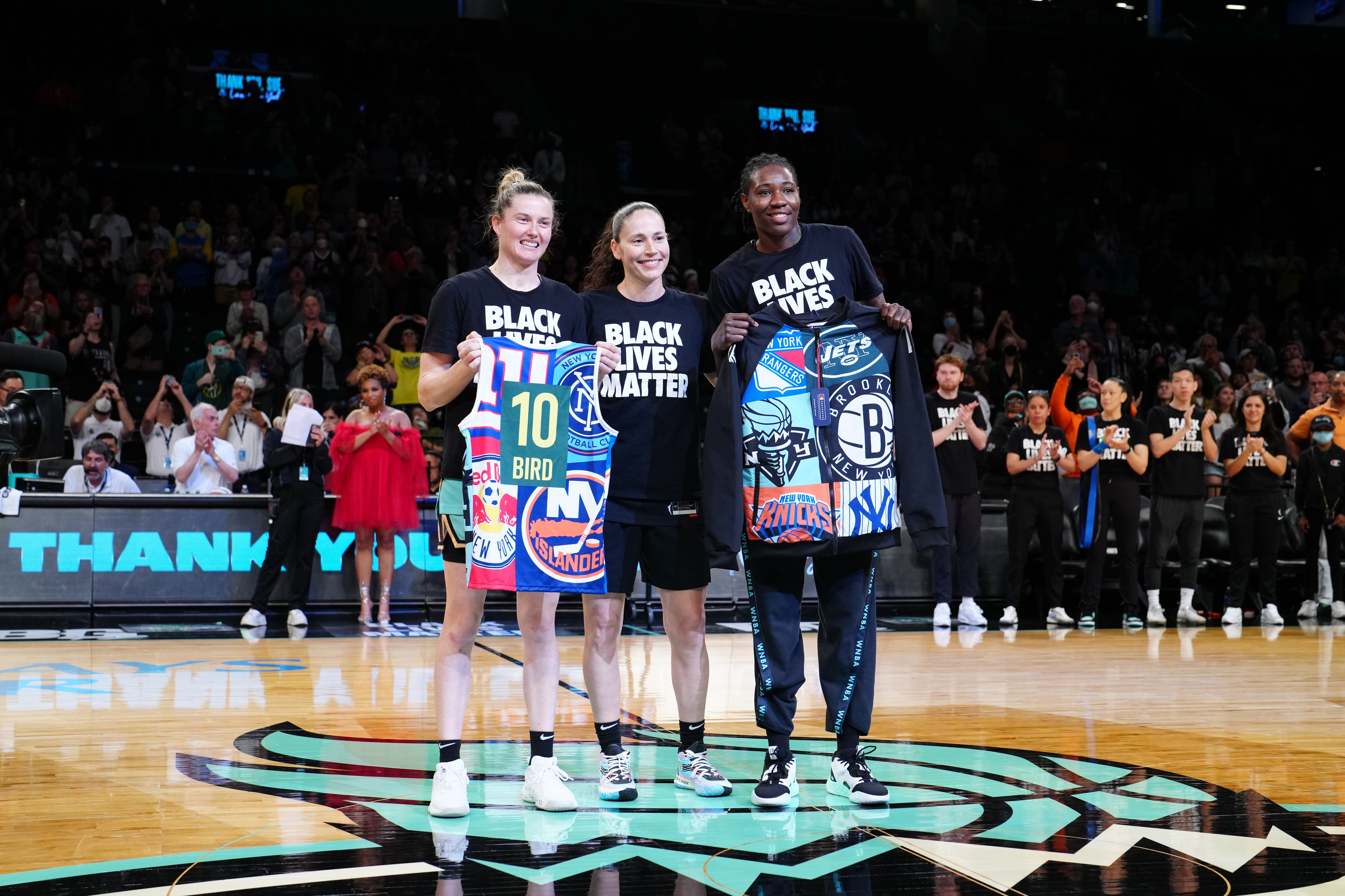 BROOKLYN, NY - JUNE 19: Sami Whitcomb #32, Natasha Howard and the New York Liberty honor Sue Bird #10 of the Seattle Storm before the game on June 19, 2022 at the Barclays Center in Brooklyn, New York. NOTE TO USER: User expressly acknowledges and agrees that, by downloading and or using this photograph, user is consenting to the terms and conditions of the Getty Images License Agreement. Mandatory Copyright Notice: Copyright 2022 NBAE (Photo by Evan Yu/NBAE via Getty Images)