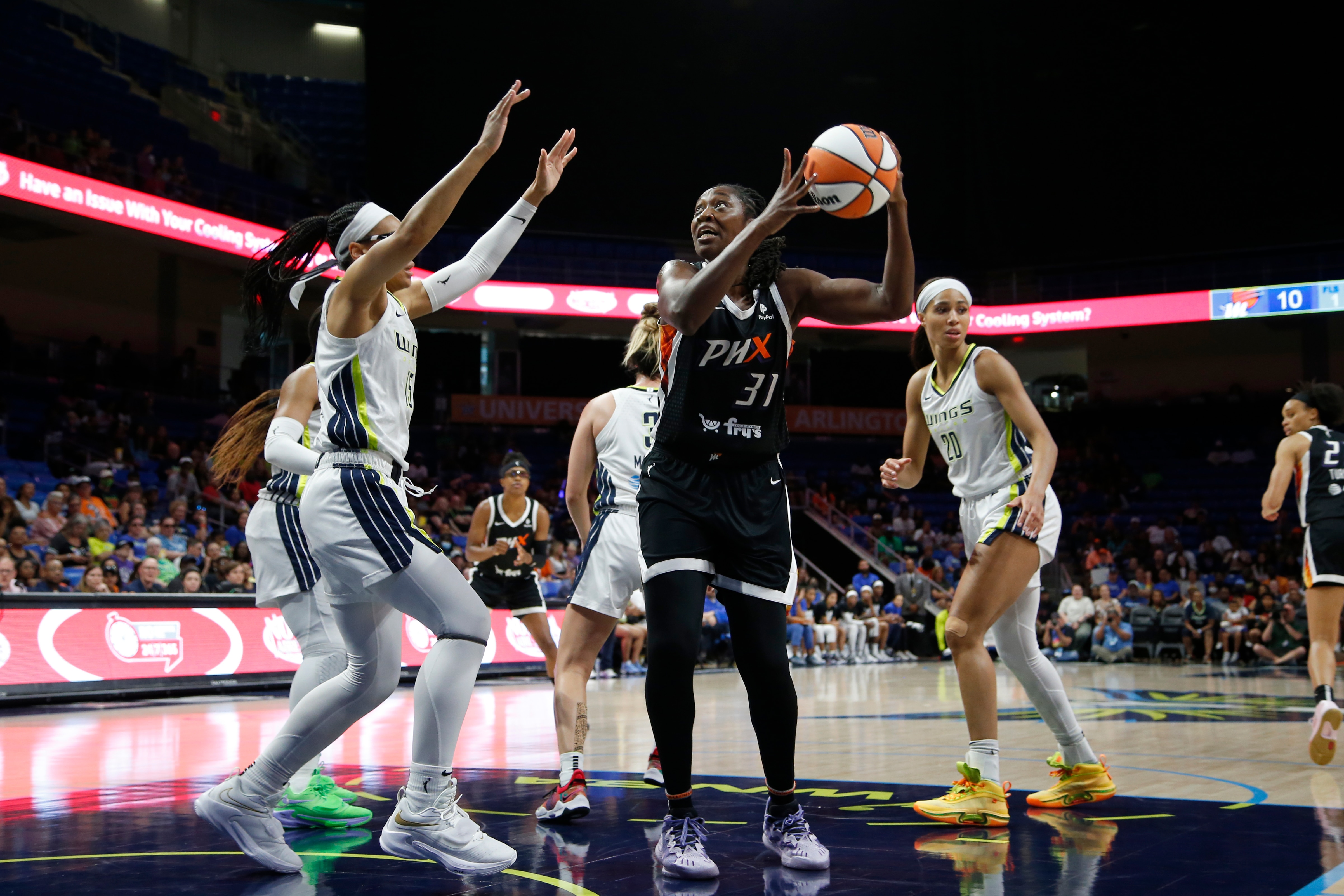 ARLINGTON, TX - JUNE 17: Tina Charles #31 of the Phoenix Mercury looks to pass the ball during the game against the Dallas Wings on June 17, 2022 at the College Park Center in Arlington, Texas. NOTE TO USER: User expressly acknowledges and agrees that, by downloading and/or using this Photograph, user is consenting to the terms and conditions of the Getty Images License Agreement. Mandatory Copyright Notice: Copyright 2022 NBAE (Photo by Tim Heitman/NBAE via Getty Images)