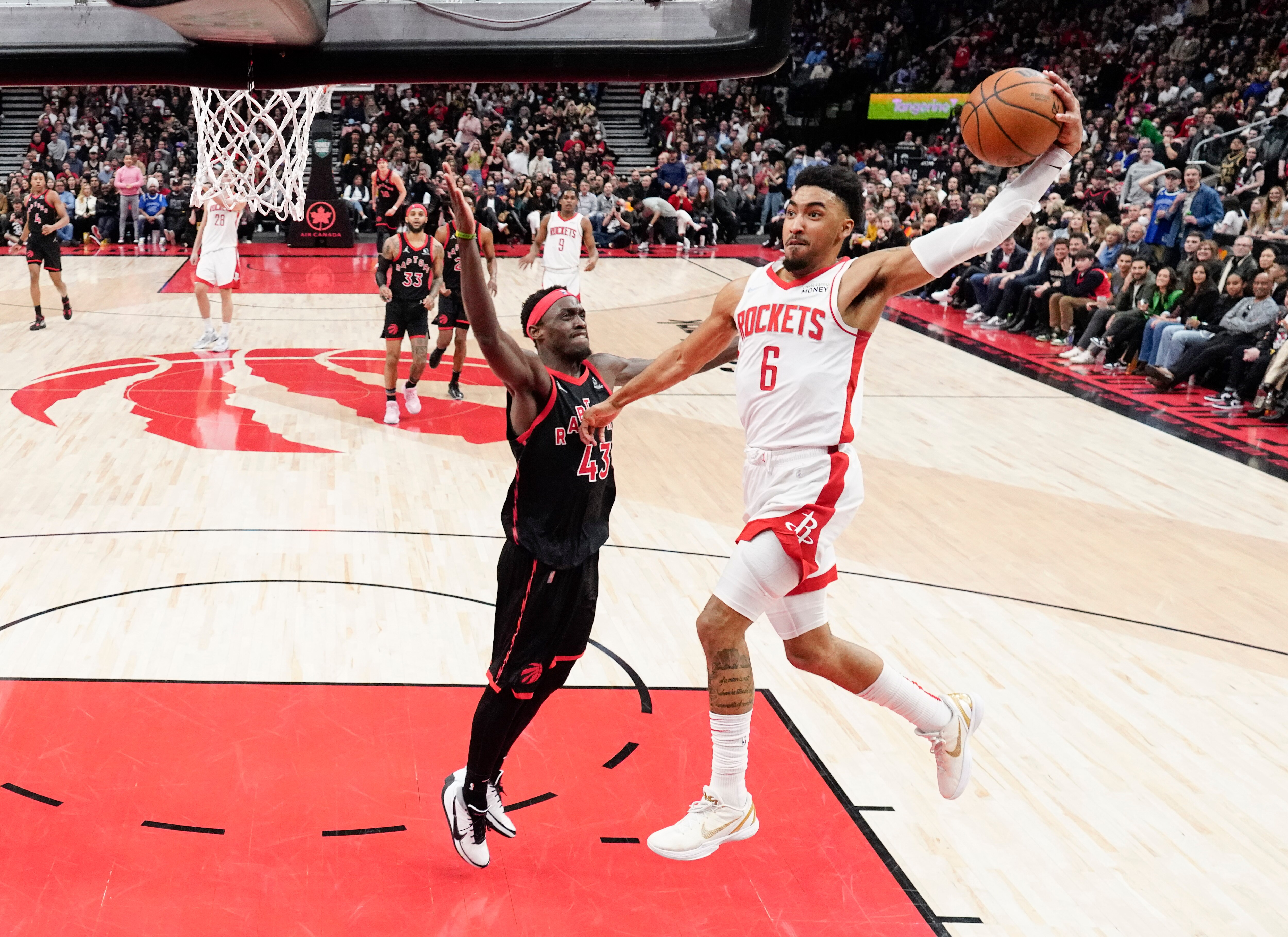 TORONTO, ON - APRIL 8: Kenyon Martin Jr. #6 of the Houston Rockets goes to the basket against Pascal Siakam #43 of the Toronto Raptors during the second half of their basketball game at the Scotiabank Arena on April 8, 2022 in Toronto, Ontario, Canada. NOTE TO USER: User expressly acknowledges and agrees that, by downloading and/or using this Photograph, user is consenting to the terms and conditions of the Getty Images License Agreement. (Photo by Mark Blinch/Getty Images) TORONTO, ON - APRIL 8: Kenyon Martin Jr. #6 of the Houston Rockets goes to the basket against Pascal Siakam #43 of the Toronto Raptors during the second half of their basketball game at the Scotiabank Arena on April 8, 2022 in Toronto, Ontario, Canada. NOTE TO USER: User expressly acknowledges and agrees that, by downloading and/or using this Photograph, user is consenting to the terms and conditions of the Getty Images License Agreement. (Photo by Mark Blinch/Getty Images)