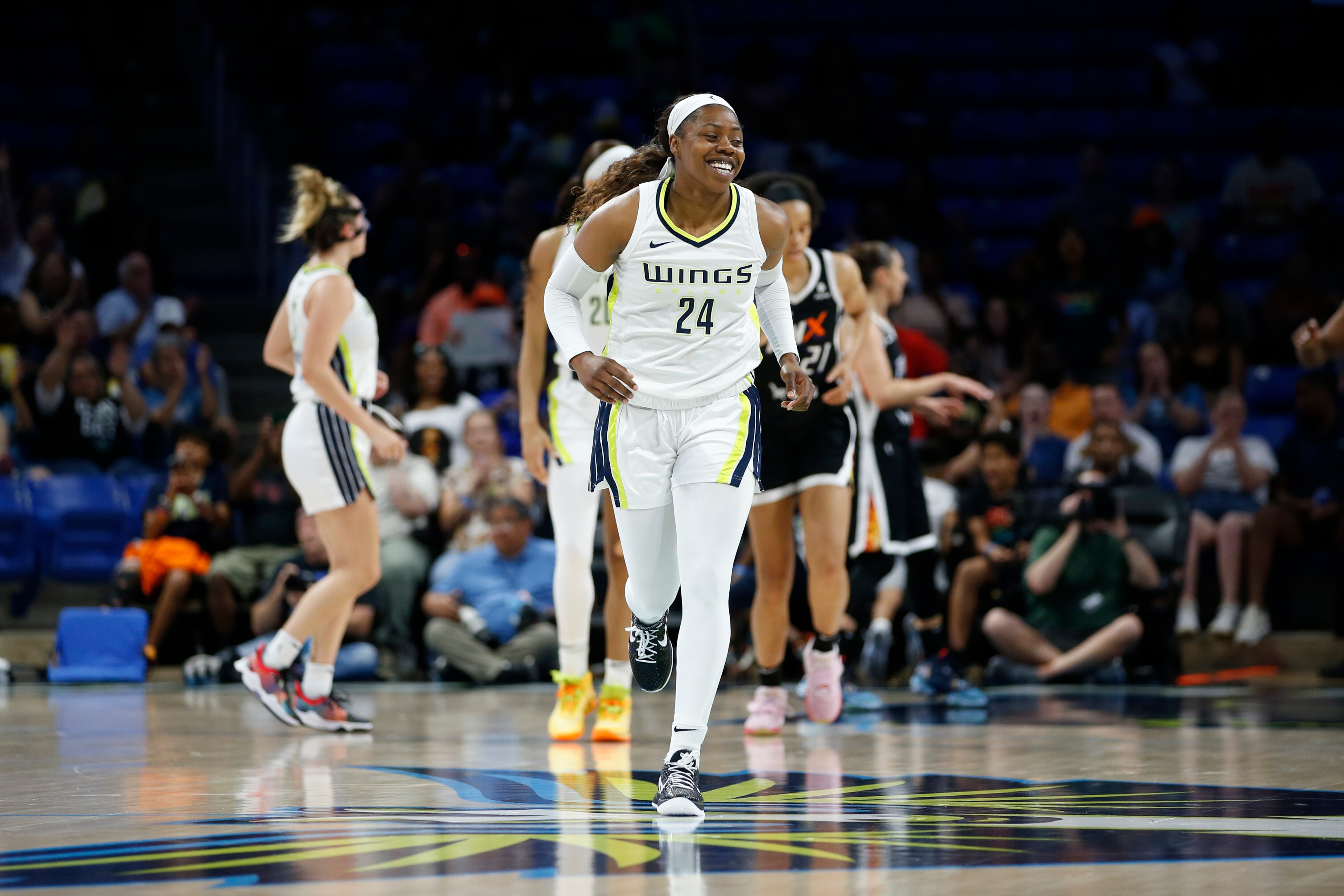 ARLINGTON, TX - JUNE 17: Arike Ogunbowale #24 of the Dallas Wings smiles during the game against the Phoenix Mercury on June 17, 2022 at the College Park Center in Arlington, Texas. NOTE TO USER: User expressly acknowledges and agrees that, by downloading and/or using this Photograph, user is consenting to the terms and conditions of the Getty Images License Agreement. Mandatory Copyright Notice: Copyright 2022 NBAE (Photo by Tim Heitman/NBAE via Getty Images)