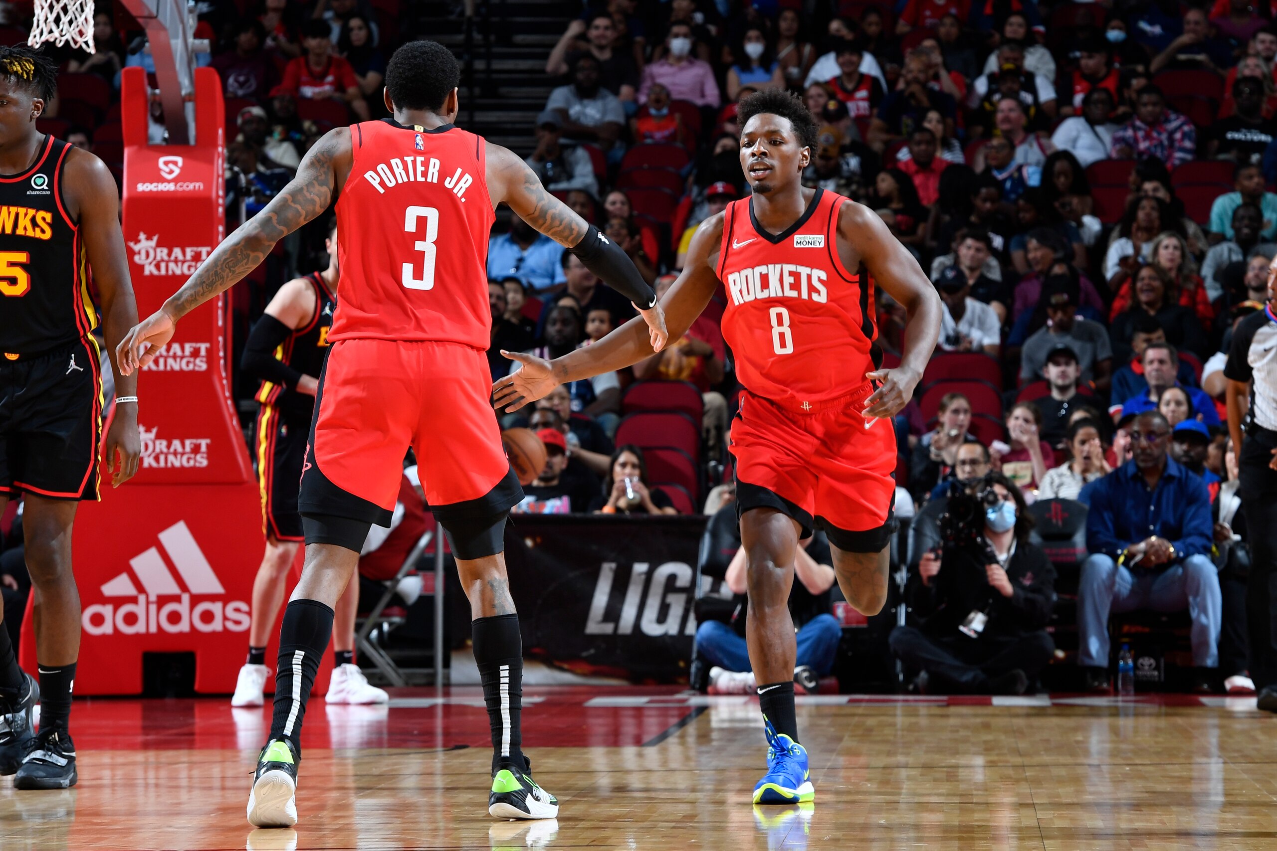 HOUSTON, TX - APRIL 10: Kevin Porter Jr. #3 hi-fives Jae'Sean Tate #8 of the Houston Rockets during the game against the Atlanta Hawks on April 10, 2022 at the Toyota Center in Houston, Texas. NOTE TO USER: User expressly acknowledges and agrees that, by downloading and or using this photograph, User is consenting to the terms and conditions of the Getty Images License Agreement. Mandatory Copyright Notice: Copyright 2022 NBAE (Photo by Logan Riely/NBAE via Getty Images)