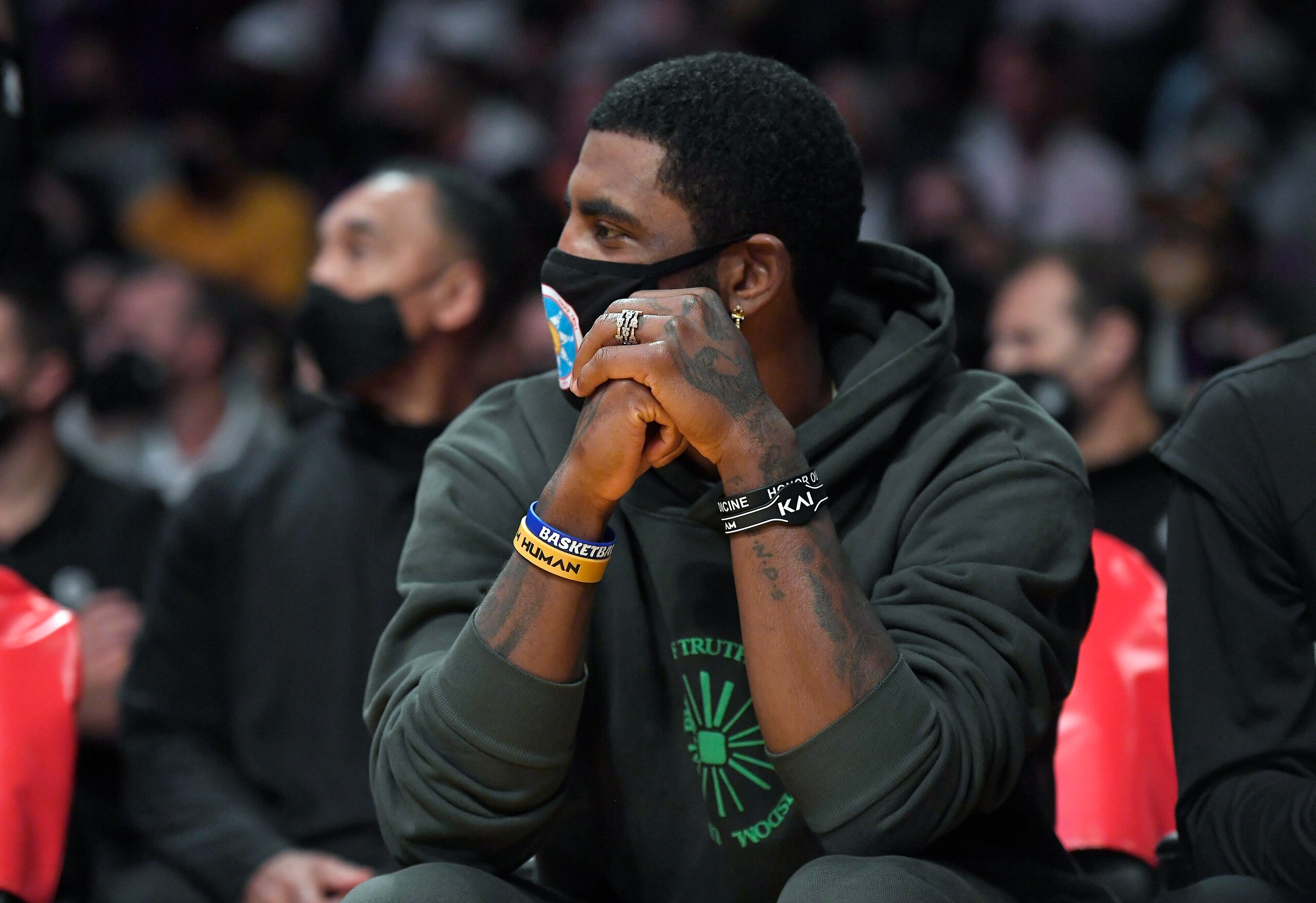 LOS ANGELES, CA - OCTOBER 03: Kyrie Irving #11 of the Brooklyn Nets follows the action from the bench during a preseason game against the Los Angeles Lakers at Staples Center on October 3, 2021 in Los Angeles, California. NOTE TO USER: User expressly acknowledges and agrees that, by downloading and/or using this Photograph, user is consenting to the terms and conditions of the Getty Images License Agreement. (Photo by Kevork Djansezian/Getty Images)