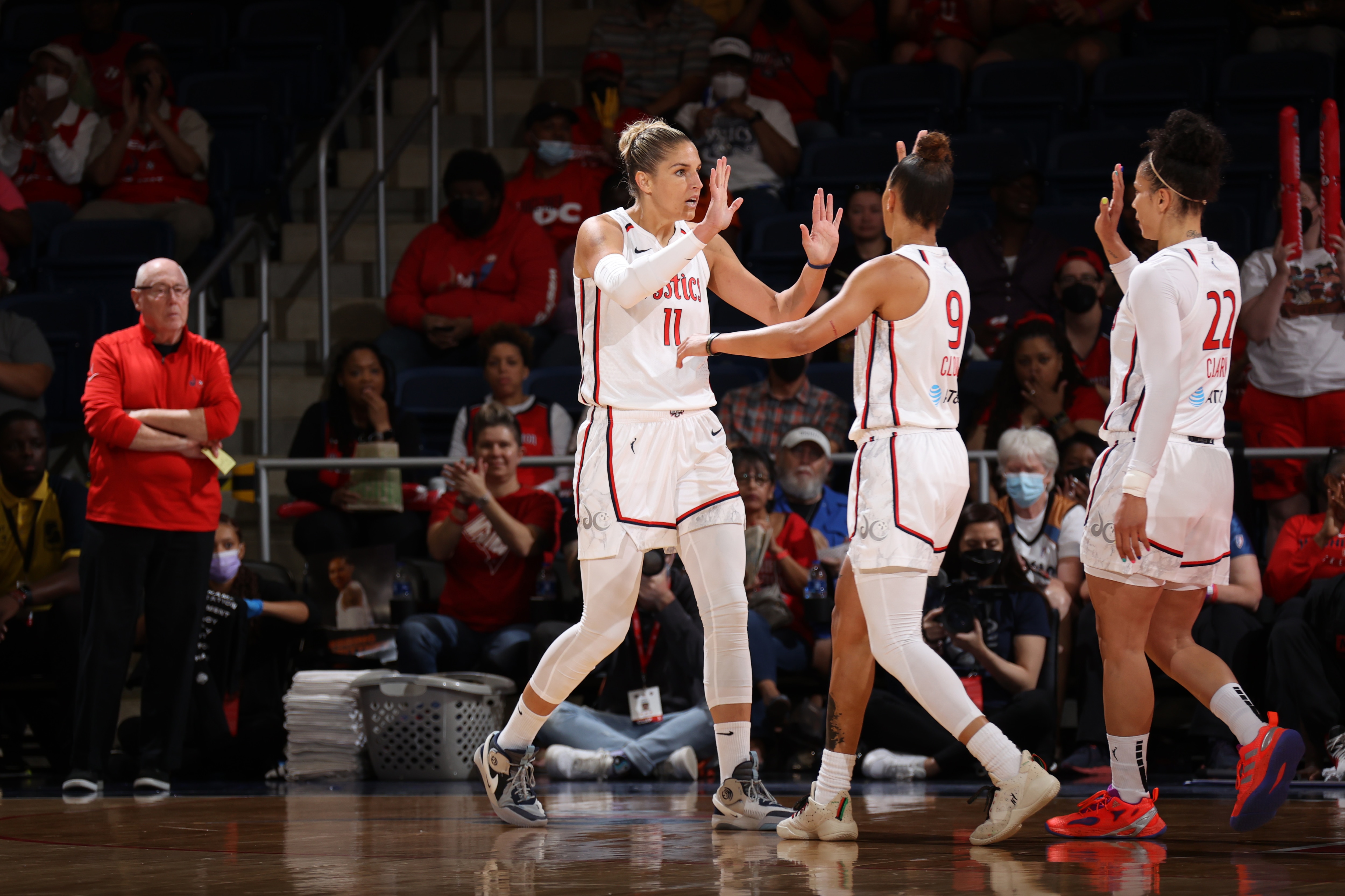 WASHINGTON, DC - JUNE 19: Elena Delle Donne #11 of the Washington Mystics high fives Natasha Cloud #9 of the Washington Mystics during the game against the Connecticut Sun on June 19, 2022 at Entertainment & Sports Arena in Washington, DC. NOTE TO USER: User expressly acknowledges and agrees that, by downloading and or using this Photograph, user is consenting to the terms and conditions of the Getty Images License Agreement. Mandatory Copyright Notice: Copyright 2022 NBAE (Photo by Stephen Gosling/NBAE via Getty Images)