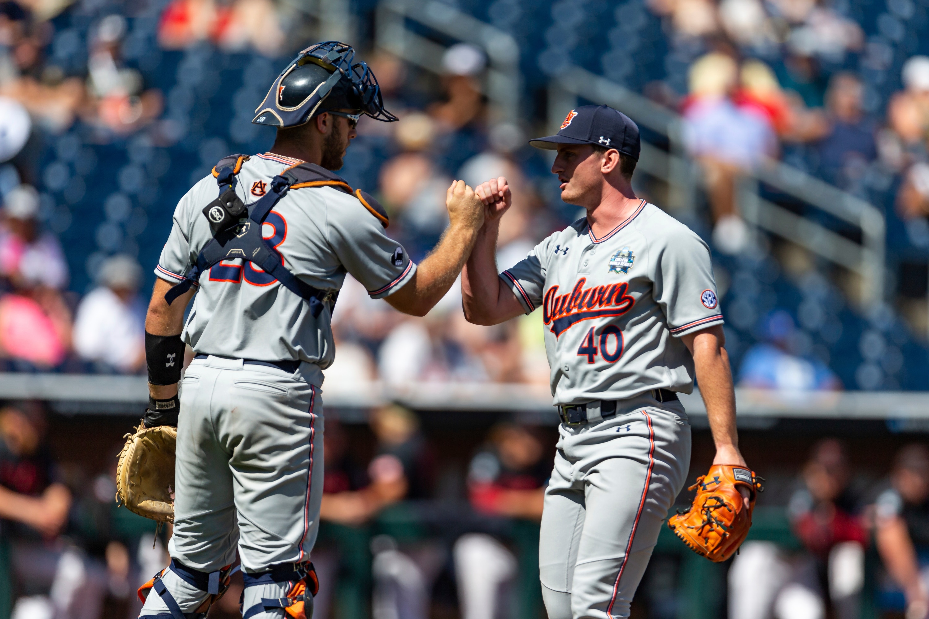 Auburn pitcher Blake Burkhalter (40) and catcher Nate LaRue (28) fist bump after the seventh inning against Stanford in an NCAA College World Series baseball game Monday, June 20, 2022, in Omaha, Neb. (AP Photo/John Peterson) Auburn pitcher Blake Burkhalter (40) and catcher Nate LaRue (28) fist bump after the seventh inning against Stanford in an NCAA College World Series baseball game Monday, June 20, 2022, in Omaha, Neb. (AP Photo/John Peterson)
