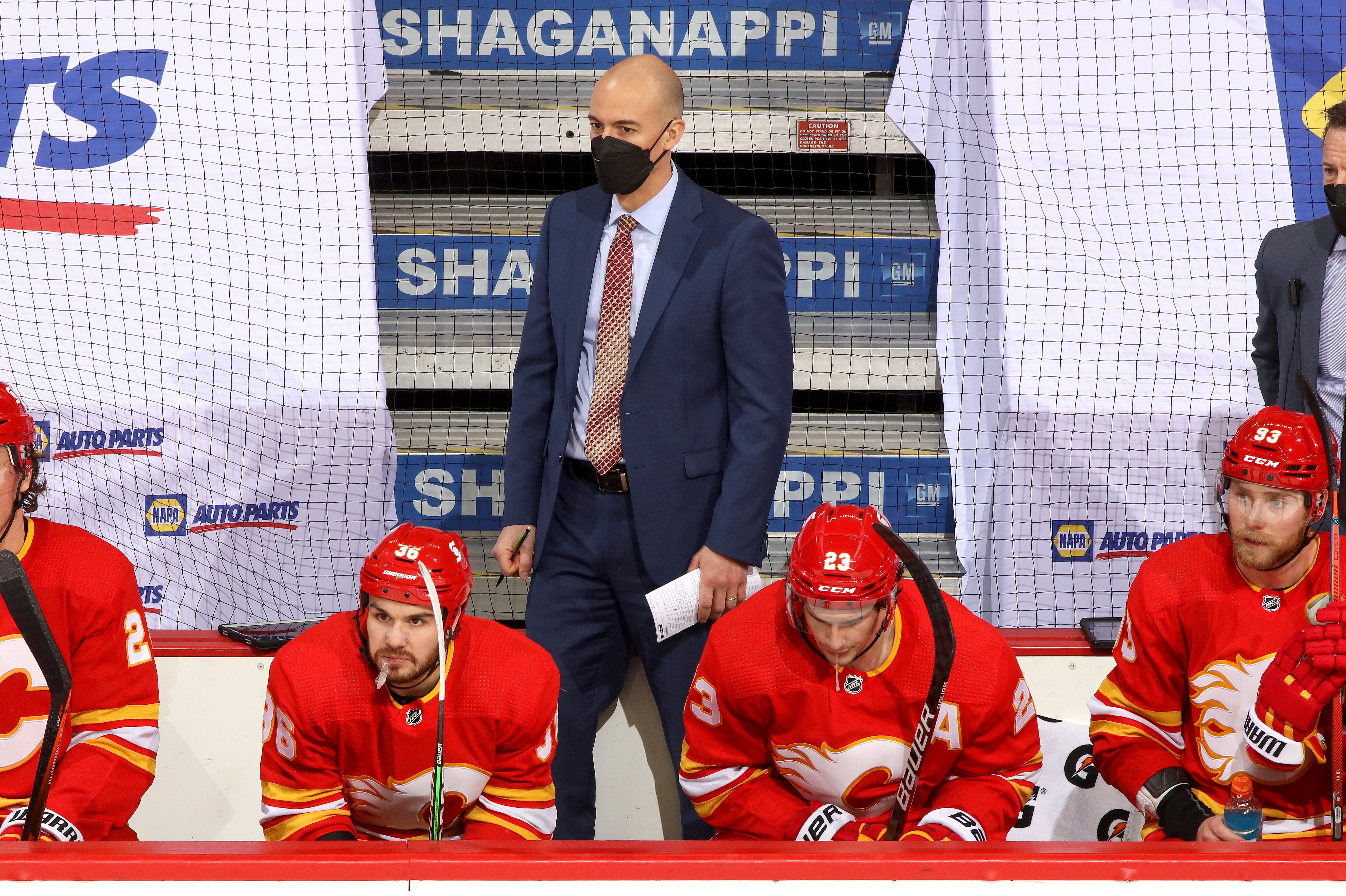 CALGARY, ALBERTA - MARCH 07: Interim Head Coach Ryan Huska of the Calgary Flames watches from the bench against the Ottawa Senators at Scotiabank Saddledome on March 07, 2021 in Calgary, Alberta. (Photo by Gerry Thomas/NHLI via Getty Images)