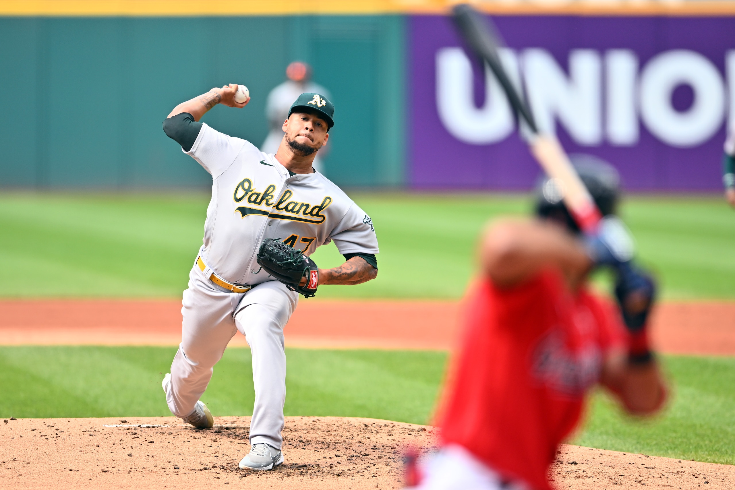 CLEVELAND, OHIO - JUNE 11: Starting pitcher Frankie Montas #47 of the Oakland Athletics pitches to Amed Rosario #1 of the Cleveland Guardians during the first inning at Progressive Field on June 11, 2022 in Cleveland, Ohio. (Photo by Jason Miller/Getty Images)