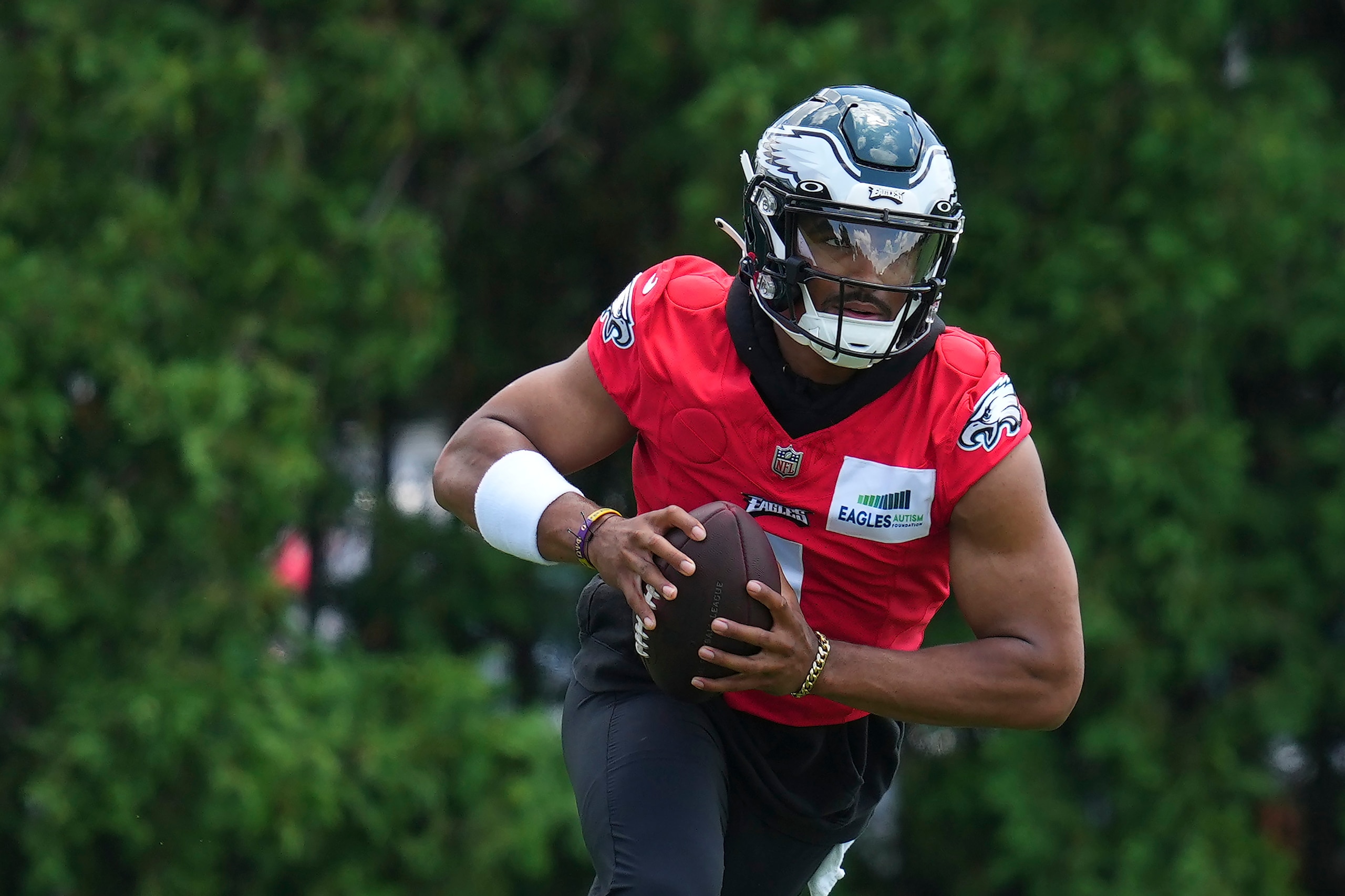 PHILADELPHIA, PA - JUNE 08: Jalen Hurts #1 of the Philadelphia Eagles runs with the ball during OTAs at the NovaCare Complex on June 8, 2022 in Philadelphia, Pennsylvania. (Photo by Mitchell Leff/Getty Images)