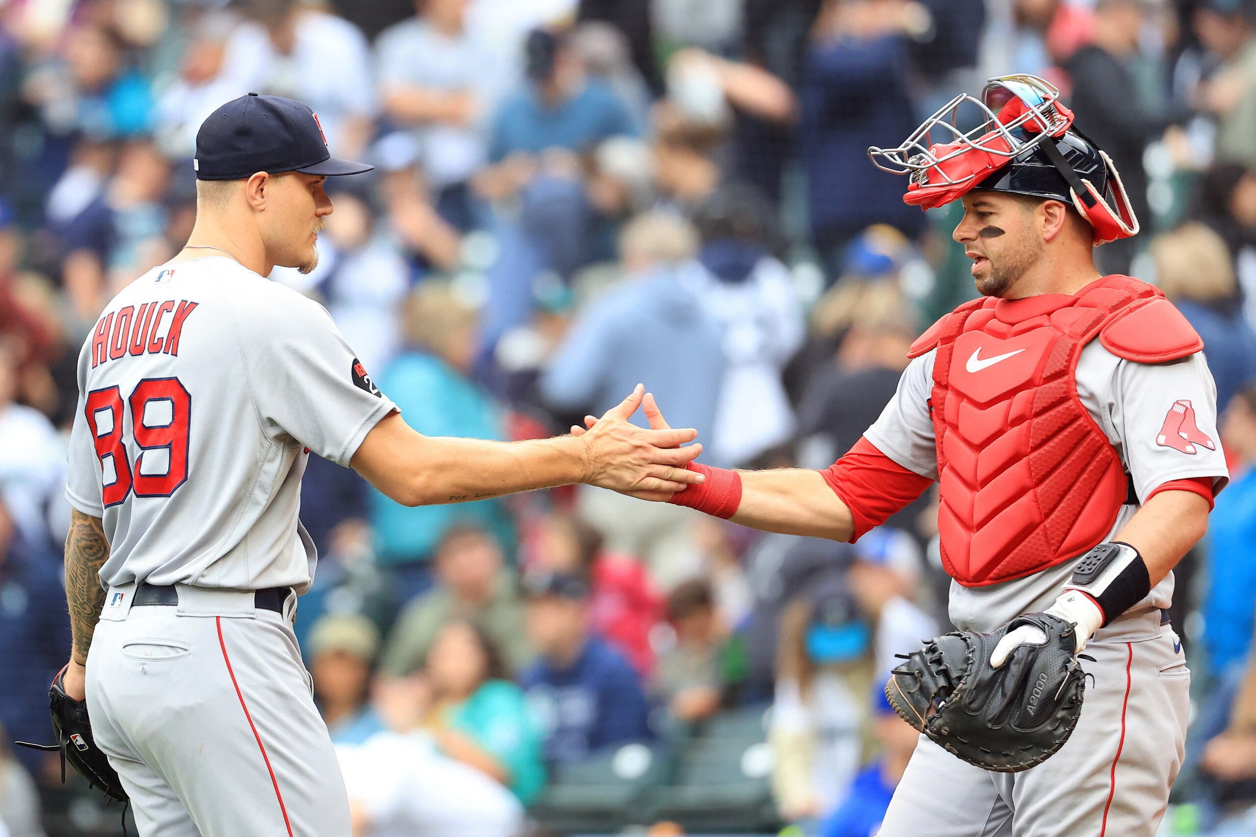 SEATTLE, WASHINGTON - JUNE 12: Tanner Houck #89 of the Boston Red Sox and Christian Vazquez #7 celebrate after forcing the final out to defeat the Seattle Mariners by a score of 2-0 at T-Mobile Park on June 12, 2022 in Seattle, Washington. (Photo by Abbie Parr/Getty Images)