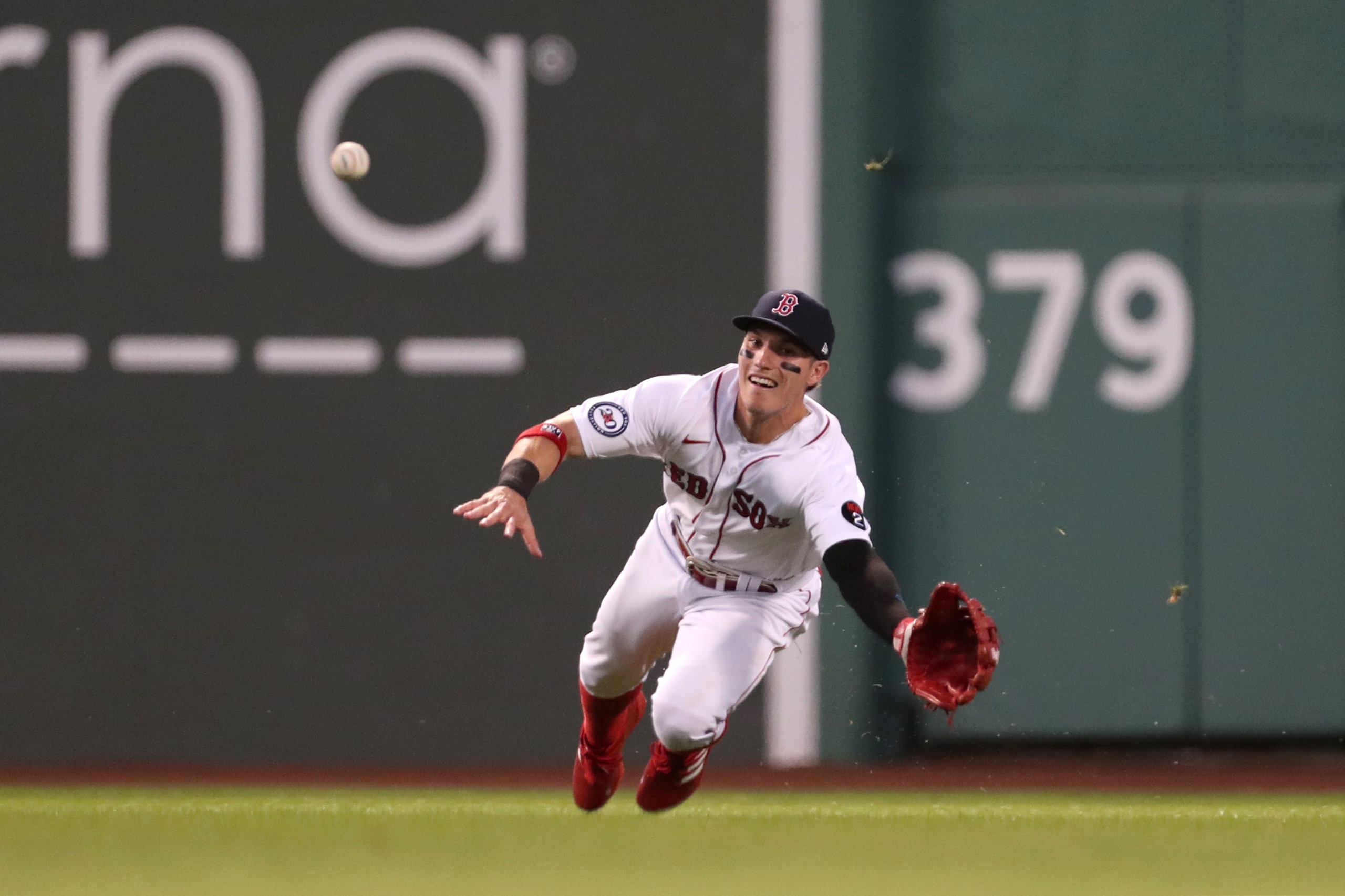 BOSTON, MASSACHUSETTS - JUNE 17: Jarren Duran #40 of the Boston Red Sox dives for a line drive during the fifth inning against the St. Louis Cardinals at Fenway Park on June 17, 2022 in Boston, Massachusetts. (Photo by Paul Rutherford/Getty Images)
