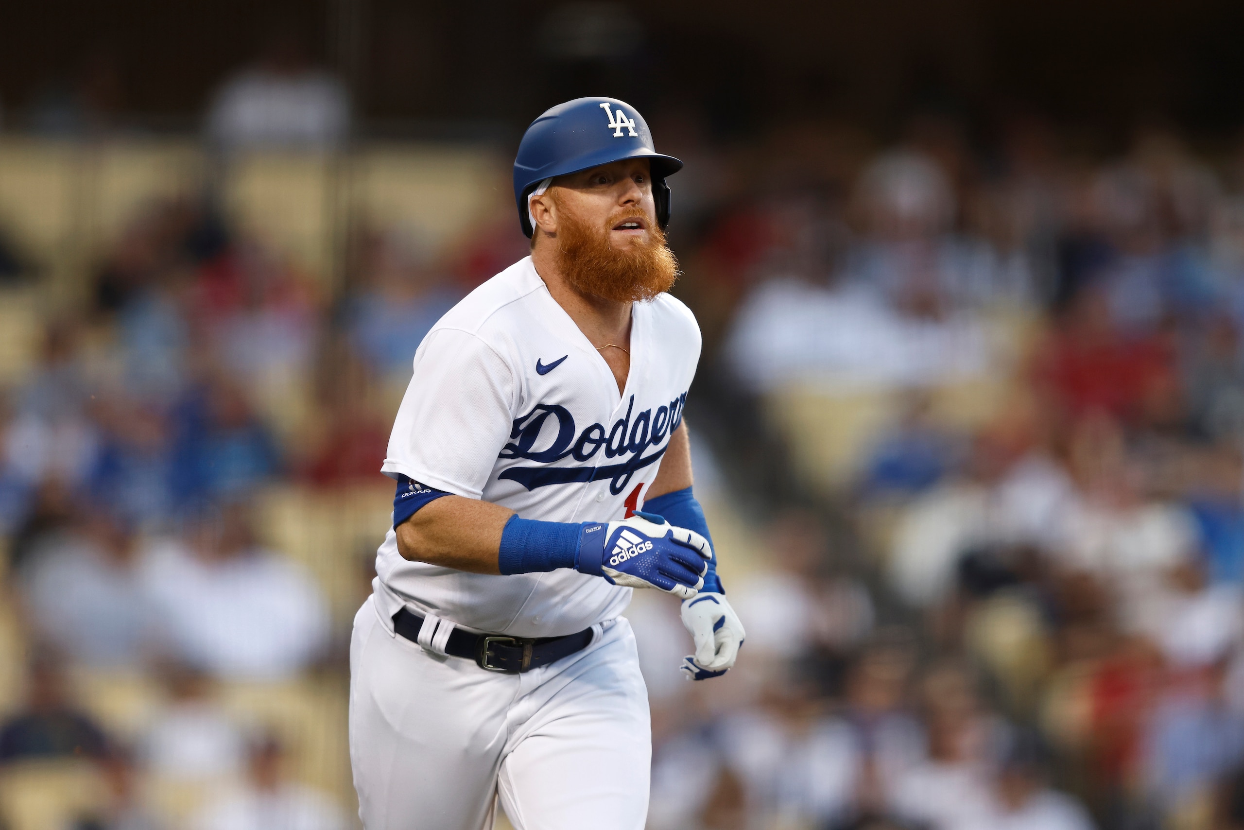 LOS ANGELES, CALIFORNIA - JUNE 14: Justin Turner #10 of the Los Angeles Dodgers looks on as he runs to first base against the Los Angeles Angels during the second inning at Dodger Stadium on June 14, 2022 in Los Angeles, California. (Photo by Michael Owens/Getty Images)