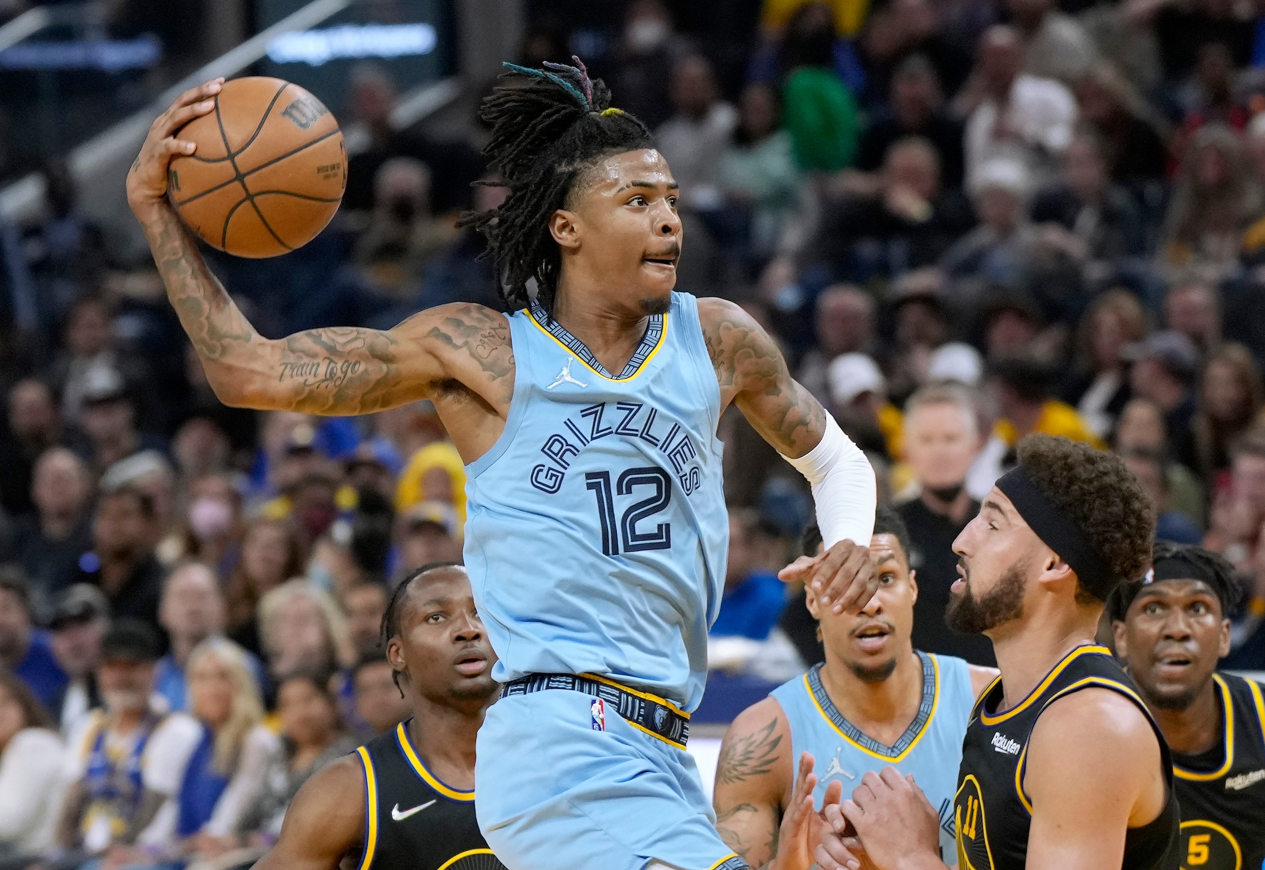 SAN FRANCISCO, CALIFORNIA - MAY 07: Ja Morant #12 of the Memphis Grizzlies drives to the basket to shoot against the Golden State Warriors in the second half of Game Three of the Western Conference Semifinals of the NBA Playoffs at Chase Center on May 07, 2022 in San Francisco, California. NOTE TO USER: User expressly acknowledges and agrees that, by downloading and or using this photograph, User is consenting to the terms and conditions of the Getty Images License Agreement. (Photo by Thearon W. Henderson/Getty Images) SAN FRANCISCO, CALIFORNIA - MAY 07: Ja Morant #12 of the Memphis Grizzlies drives to the basket to shoot against the Golden State Warriors in the second half of Game Three of the Western Conference Semifinals of the NBA Playoffs at Chase Center on May 07, 2022 in San Francisco, California. NOTE TO USER: User expressly acknowledges and agrees that, by downloading and or using this photograph, User is consenting to the terms and conditions of the Getty Images License Agreement. (Photo by Thearon W. Henderson/Getty Images)