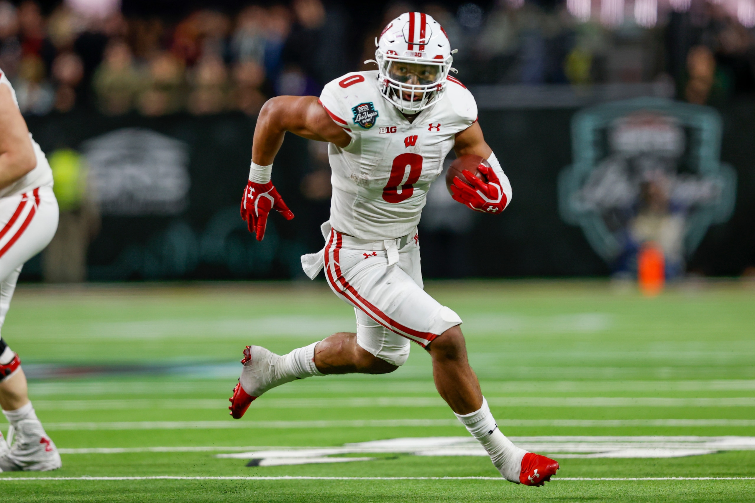 LAS VEGAS, NV - DECEMBER 30: Wisconsin Badgers running back Braelon Allen (0) runs the ball for a gain during the SRS Distribution Las Vegas Bowl between the Wisconsin Badgers and the Arizona State Sun Devils on December 30, 2021 at Allegiant Stadium in Las Vegas, NV. (Photo by Jordon Kelly/Icon Sportswire via Getty Images) LAS VEGAS, NV - DECEMBER 30: Wisconsin Badgers running back Braelon Allen (0) runs the ball for a gain during the SRS Distribution Las Vegas Bowl between the Wisconsin Badgers and the Arizona State Sun Devils on December 30, 2021 at Allegiant Stadium in Las Vegas, NV. (Photo by Jordon Kelly/Icon Sportswire via Getty Images)