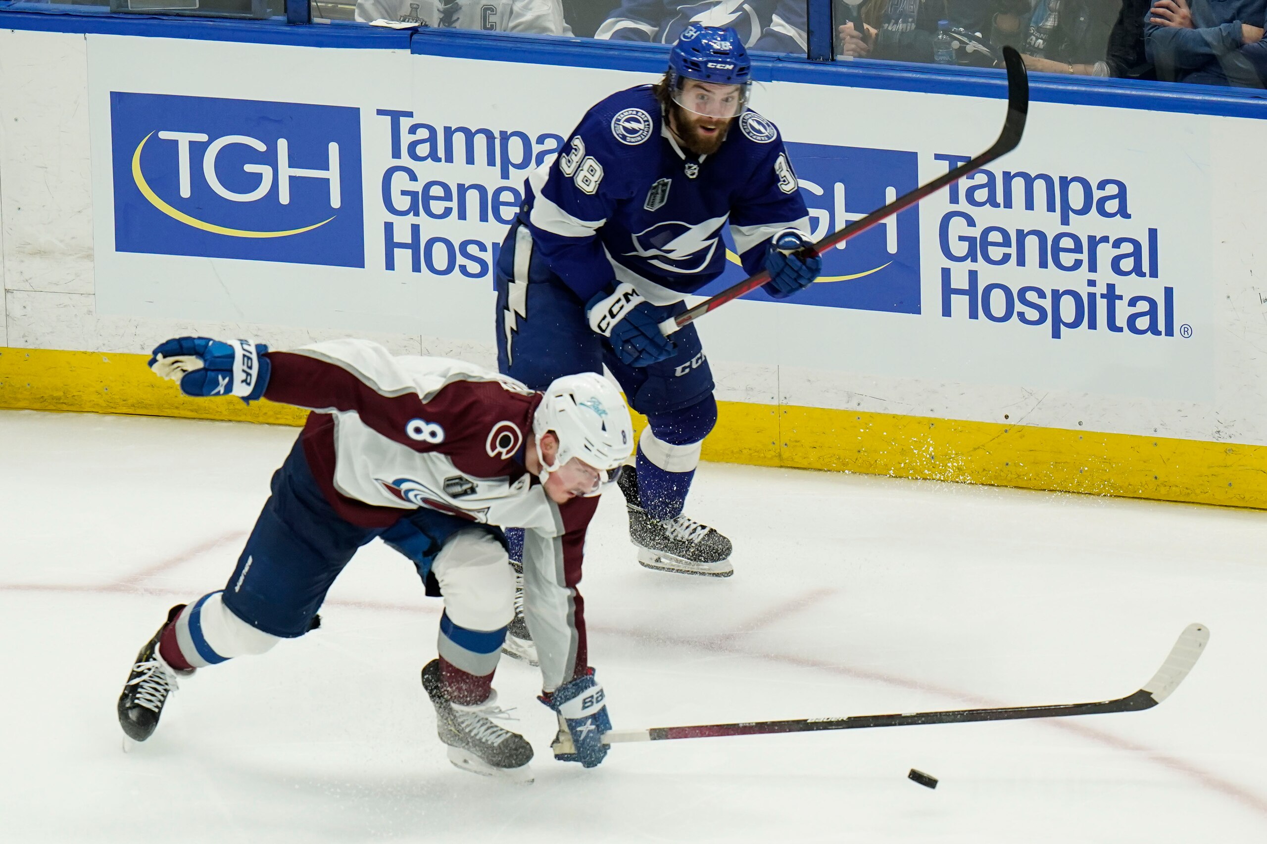 Colorado Avalanche defenseman Cale Makar (8) steals a pass from Tampa Bay Lightning left wing Brandon Hagel (38) during the third period of Game 3 of the NHL hockey Stanley Cup Final on Monday, June 20, 2022, in Tampa, Fla. (AP Photo/Chris O'Meara)