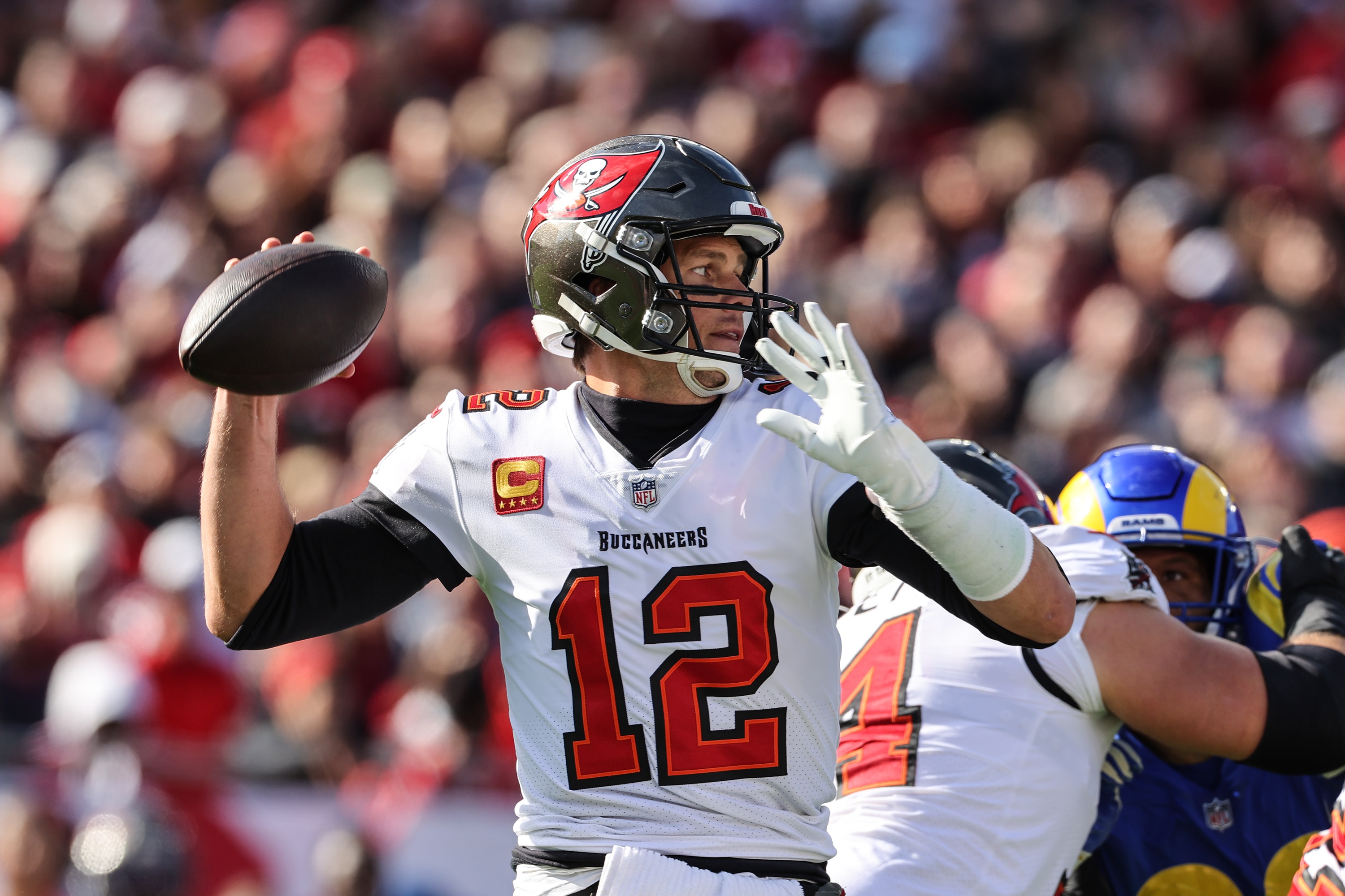Tampa, Florida, Sunday, January 23, 2022 - Tampa quarterback Tom Brady passes during a first half drive against the Rams in the NFC Divisional Playoff at Raymond James Stadium. (Robert Gauthier/Los Angeles Times via Getty Images)