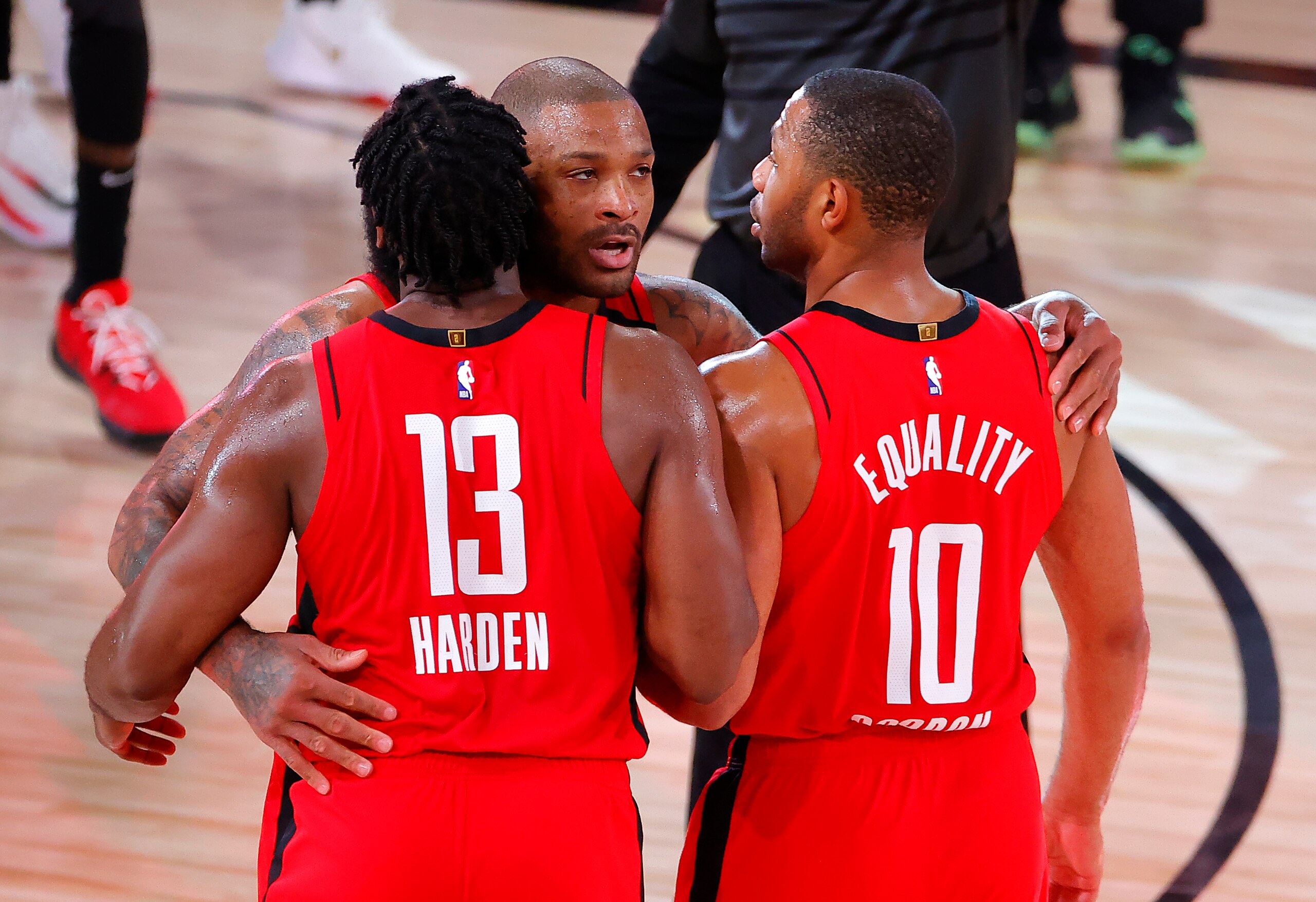LAKE BUENA VISTA, FLORIDA - AUGUST 20: P.J. Tucker #17 of the Houston Rockets, James Harden #13 of the Houston Rockets and Eric Gordon #10 of the Houston Rockets celebrate their win over Oklahoma City Thunder in Game Two of the Western Conference First Round during the 2020 NBA Playoffs at AdventHealth Arena at ESPN Wide World Of Sports Complex on August 20, 2020 in Lake Buena Vista, Florida. NOTE TO USER: User expressly acknowledges and agrees that, by downloading and or using this photograph, User is consenting to the terms and conditions of the Getty Images License Agreement. (Photo by Kevin C. Cox/Getty Images)