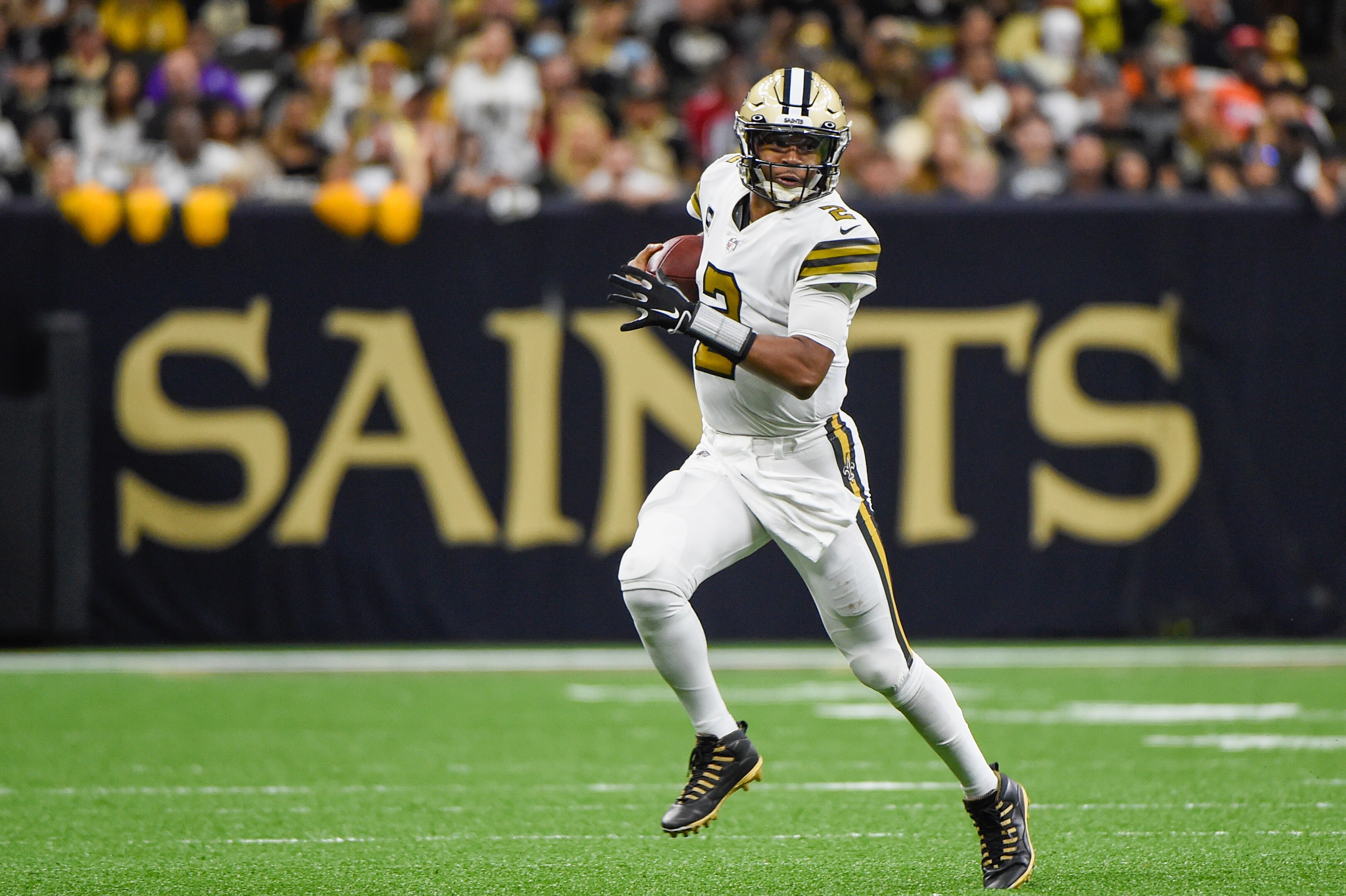NEW ORLEANS, LA - OCTOBER 31: New Orleans Saints quarterback Jameis Winston (2) looks for running room to the outside after being flushed from the pocket during first half action during the football game between the Tampa Bay Buccaneers and New Orleans Saints at Caesar's Superdome on October 31, 2021 in New Orleans, LA. (Photo by Ken Murray/Icon Sportswire via Getty Images)