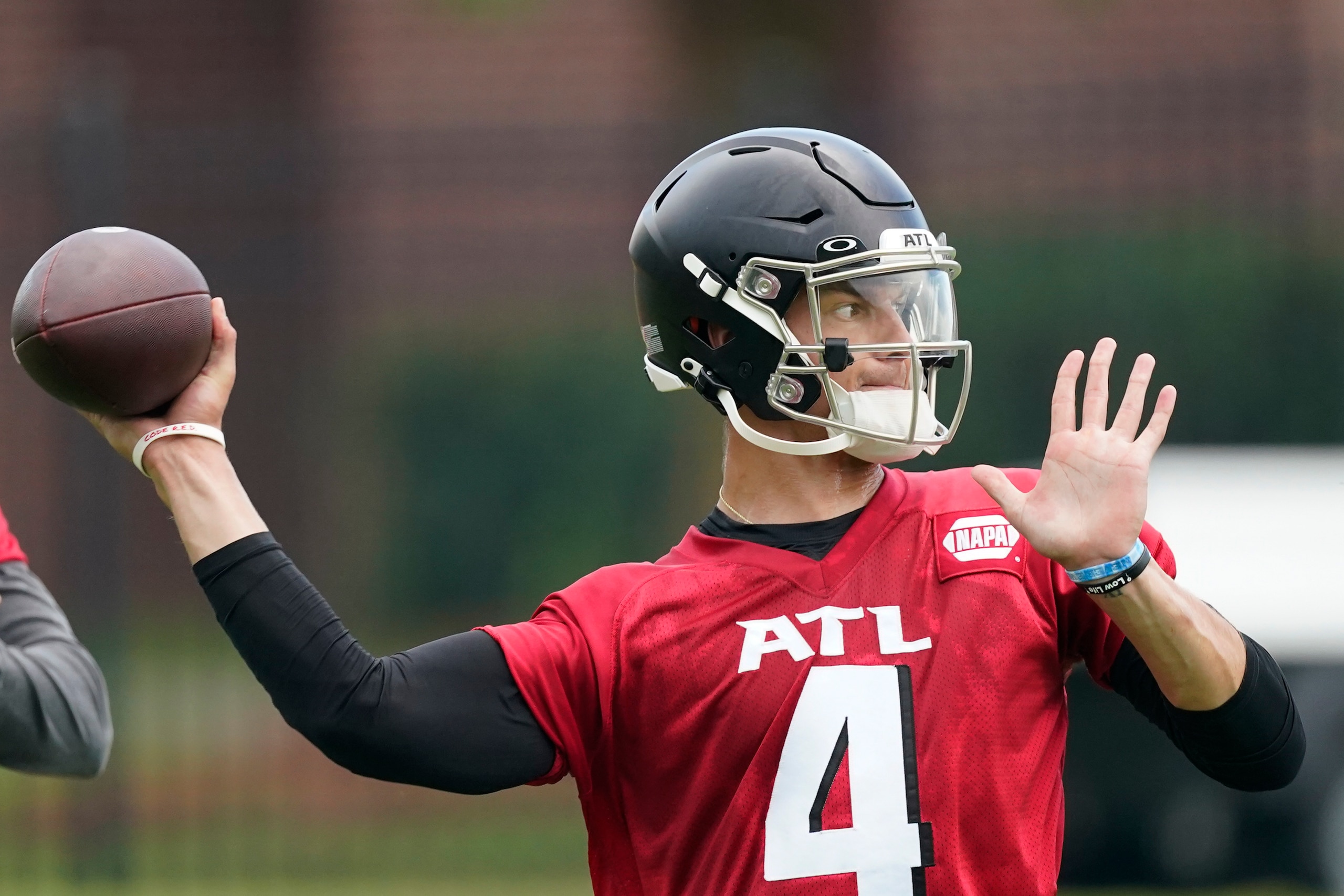 Atlanta Falcons quarterback Desmond Ridder throws a pass during their NFL minicamp football practice Tuesday, June 14, 2022, in Flowery Branch, Ga. (AP Photo/John Bazemore)